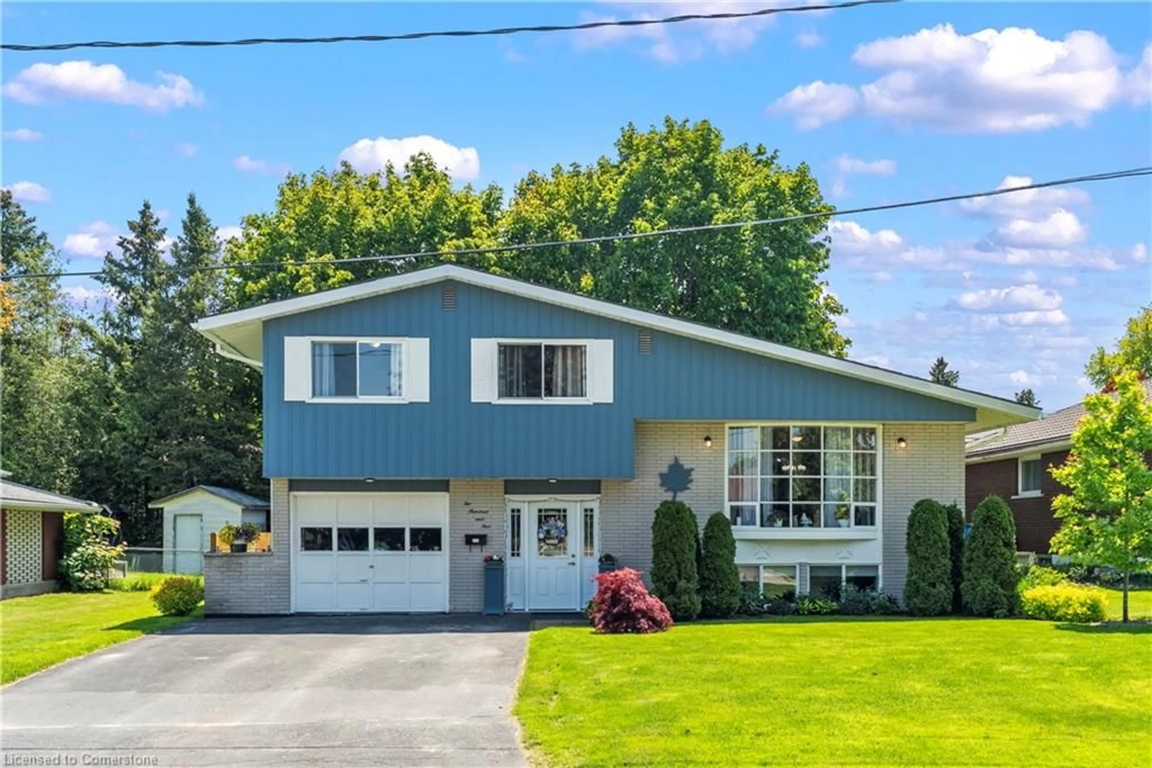 Home with vinyl exterior material, street for 205 Byeland Dr, Mount Forest Ontario N0G 2L2