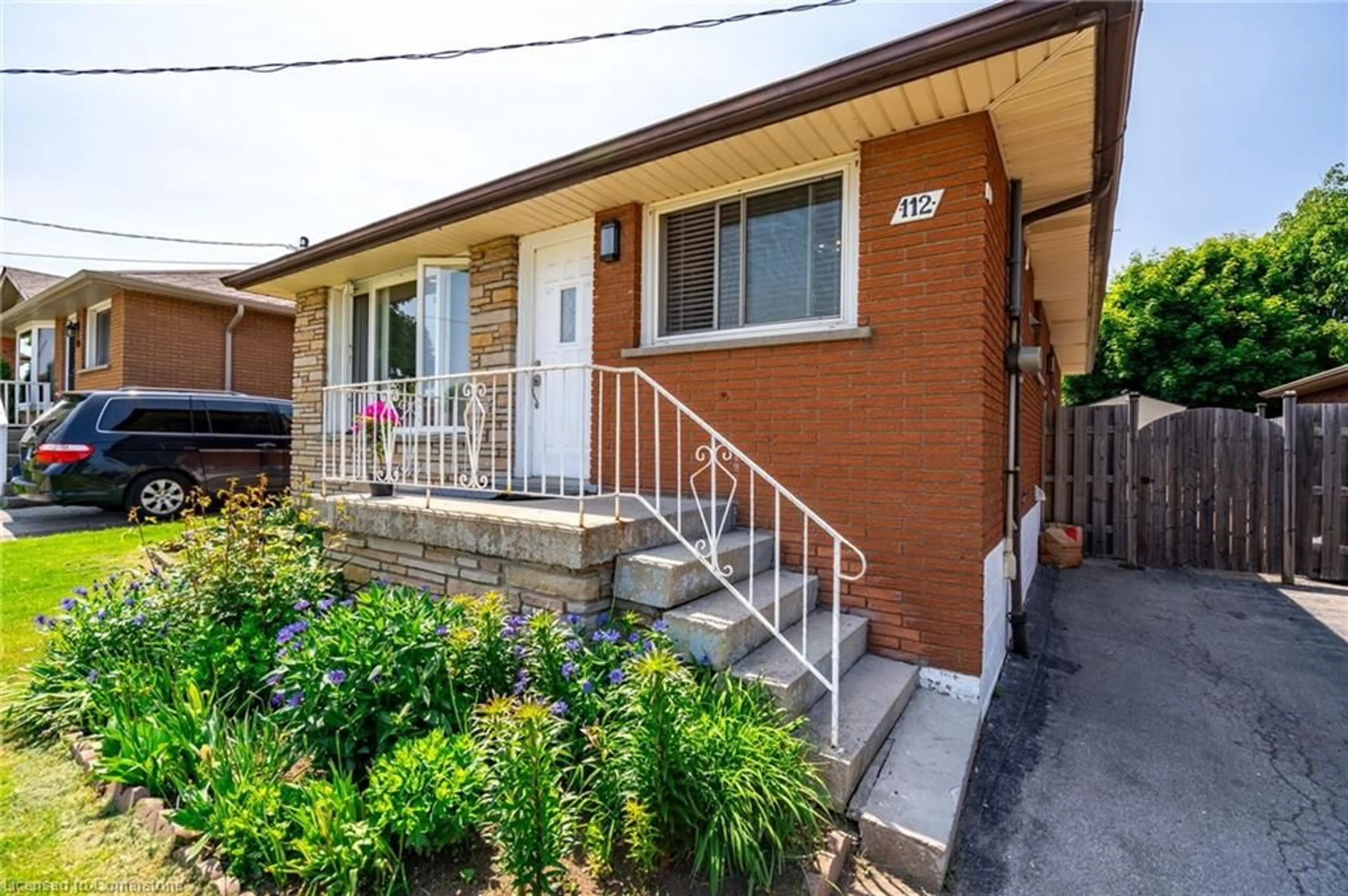 Home with brick exterior material, street for 112 Greeningdon Dr, Hamilton Ontario L9A 4W7