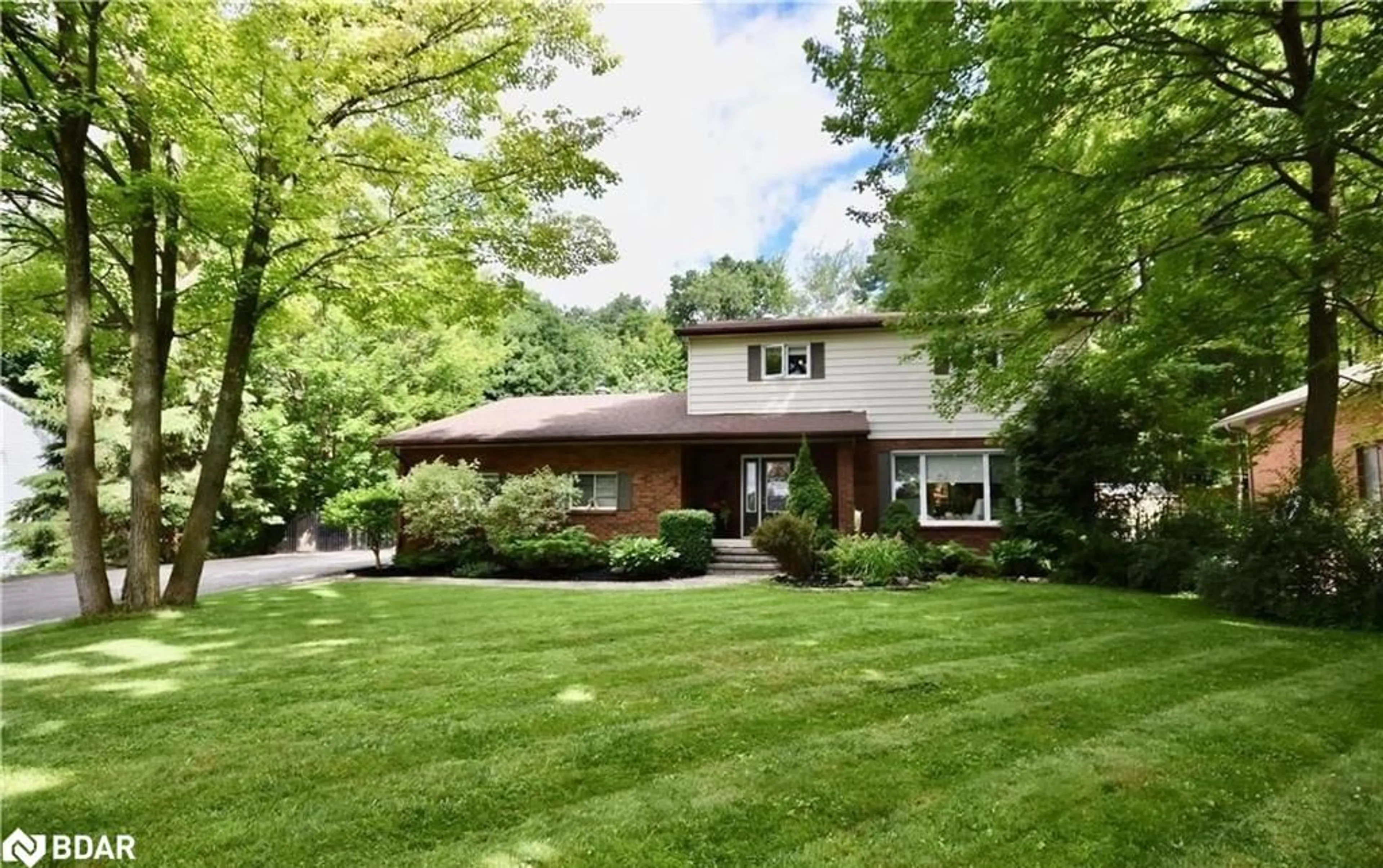 Home with brick exterior material, street for 32 Wattie Road, Springwater Ontario L9X 0P7
