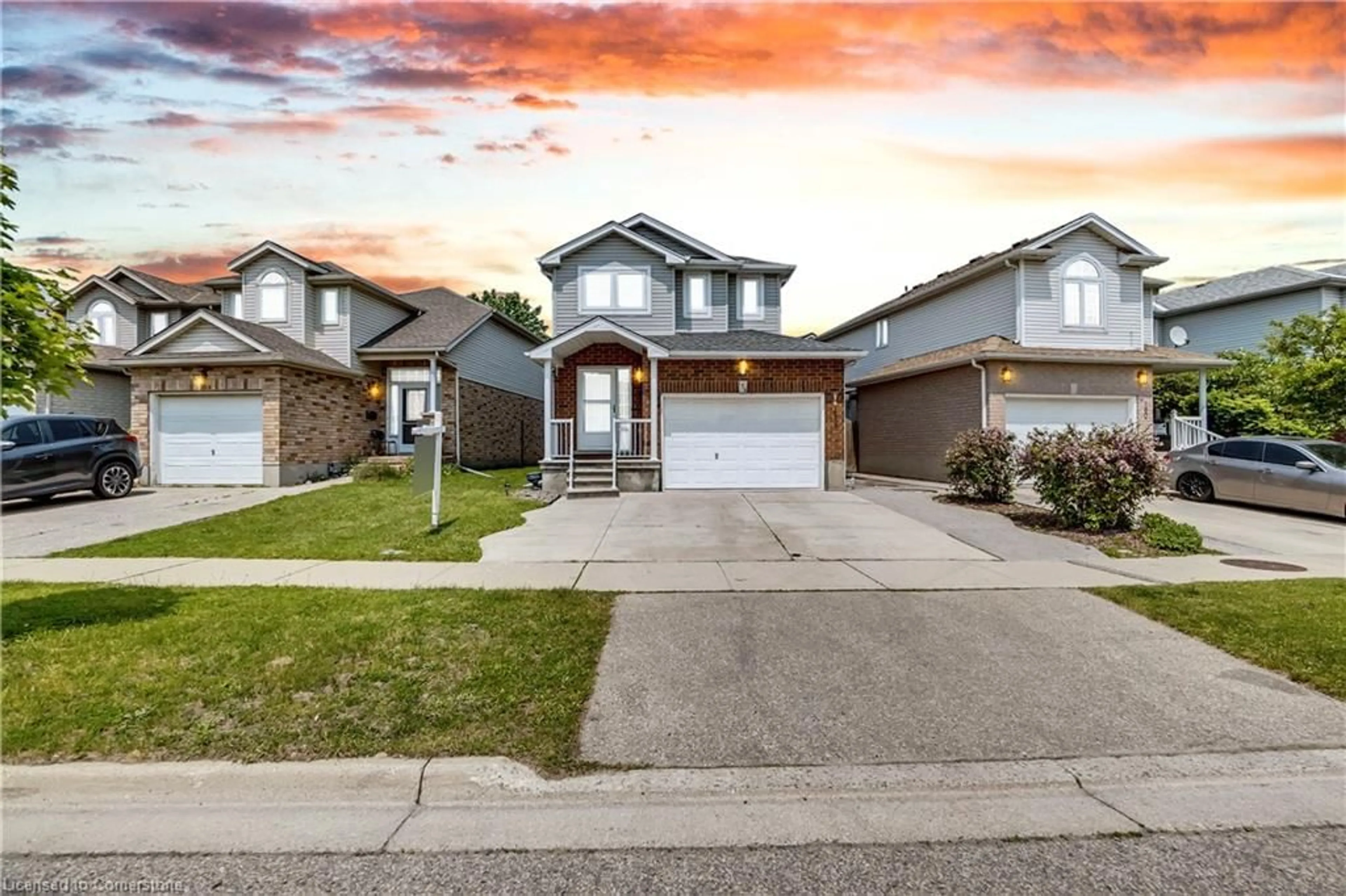 Home with brick exterior material, street for 174 Wilderness Dr, Kitchener Ontario N2E 3R7