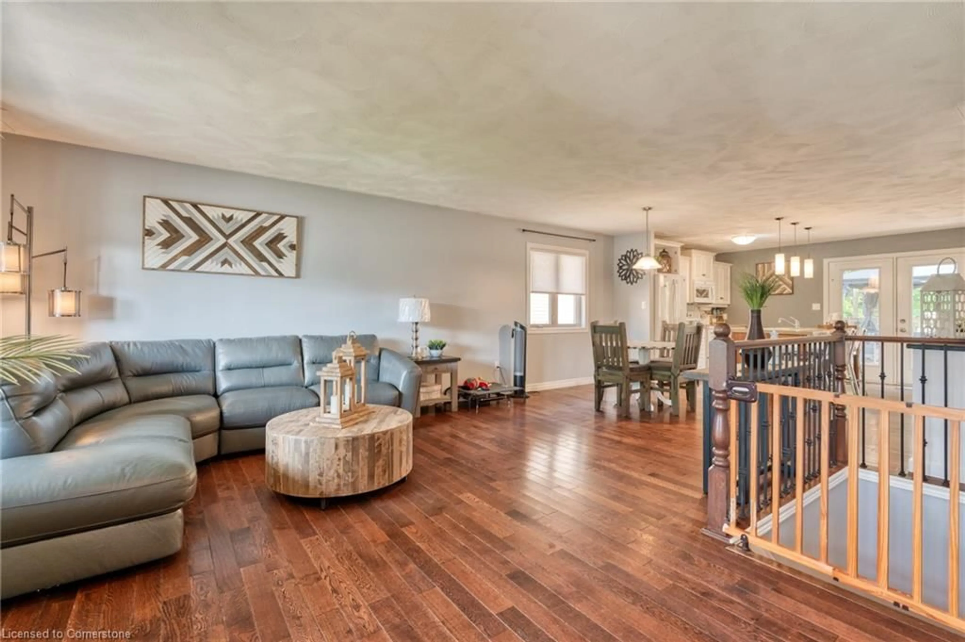 Living room with furniture, wood/laminate floor for 23 Irving Dr, Norwich Ontario N0J 1P0