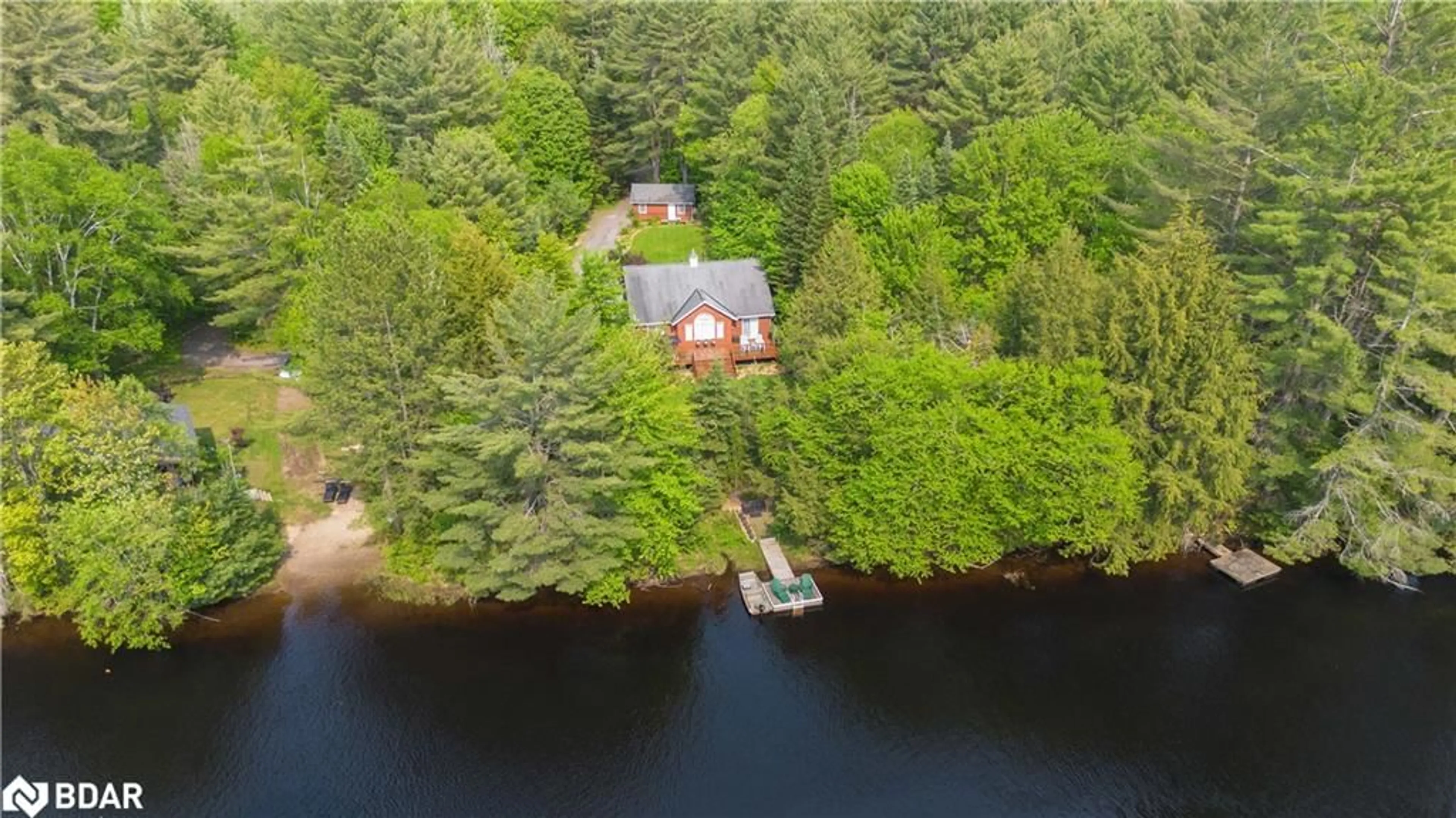 A pic from outside/outdoor area/front of a property/back of a property/a pic from drone, water/lake/river/ocean view for 1065 Forrester Trail, Bracebridge Ontario P1L 1W9
