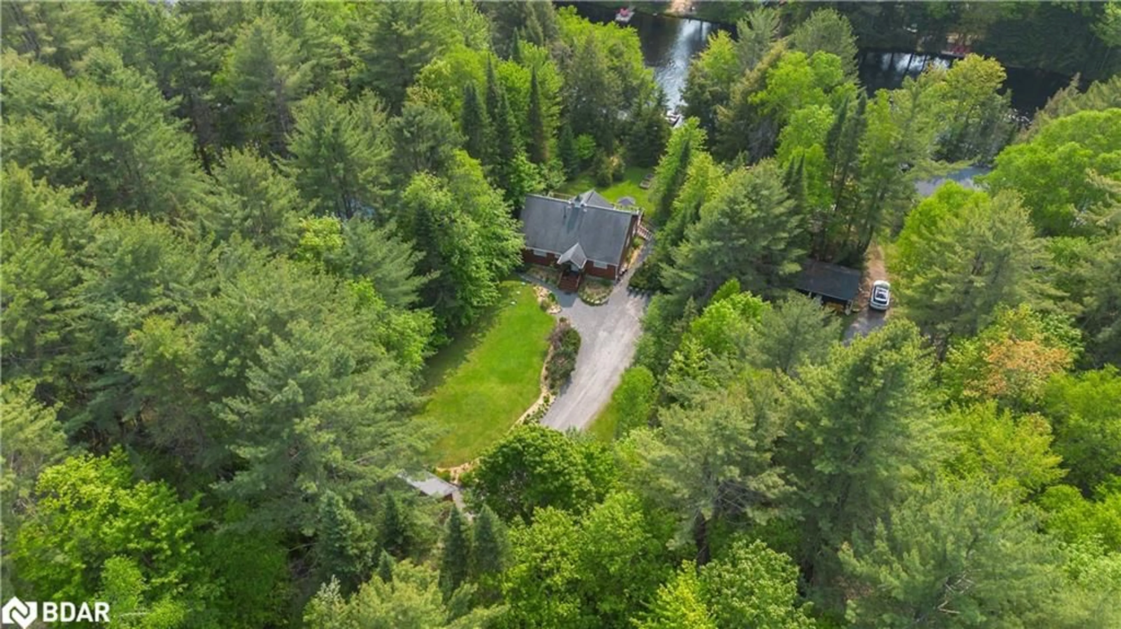 A pic from outside/outdoor area/front of a property/back of a property/a pic from drone, forest/trees view for 1065 Forrester Trail, Bracebridge Ontario P1L 1W9