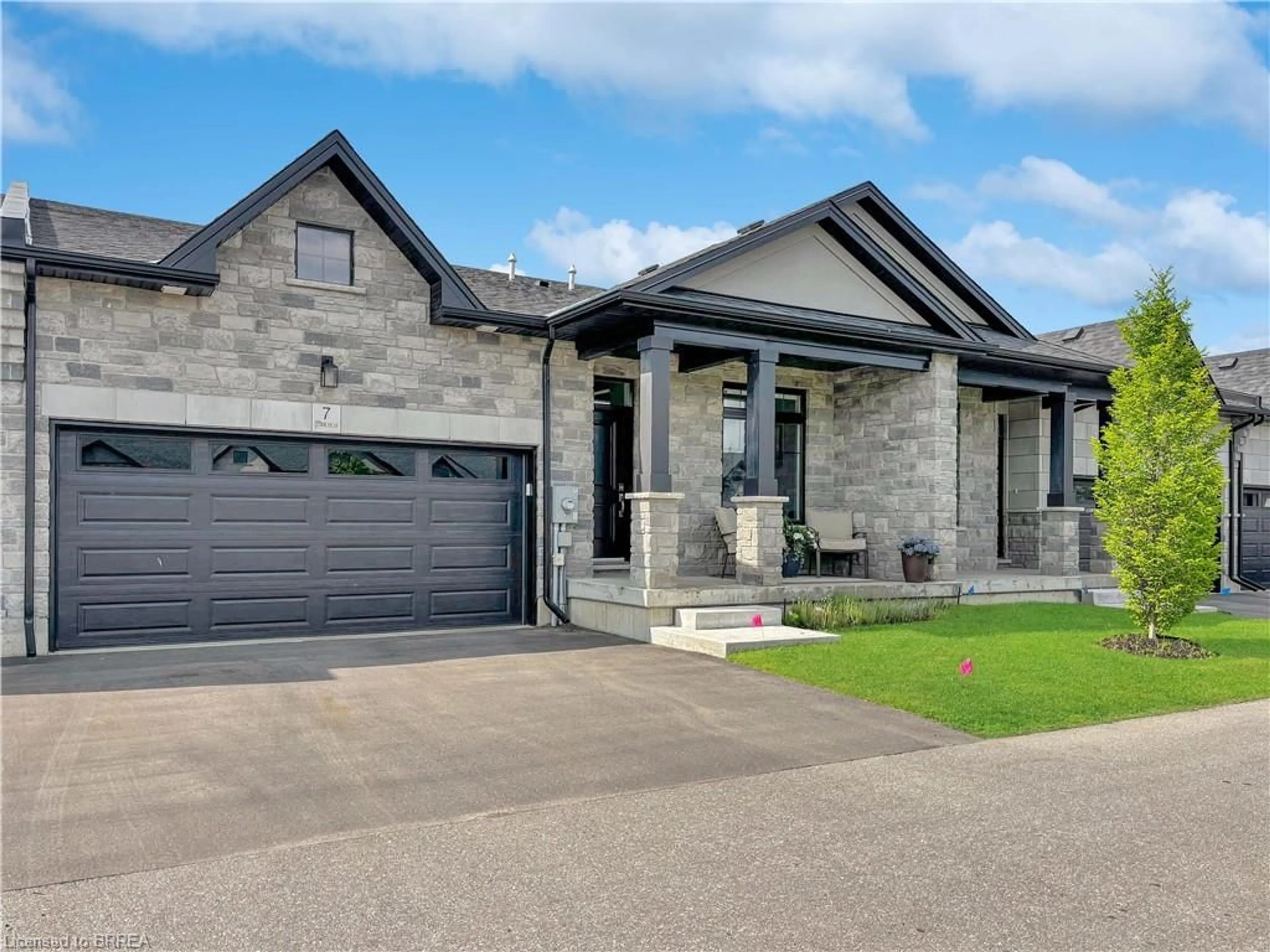 Home with brick exterior material, street for 7 Karner Blue Lane, Simcoe Ontario N3Y 4R5