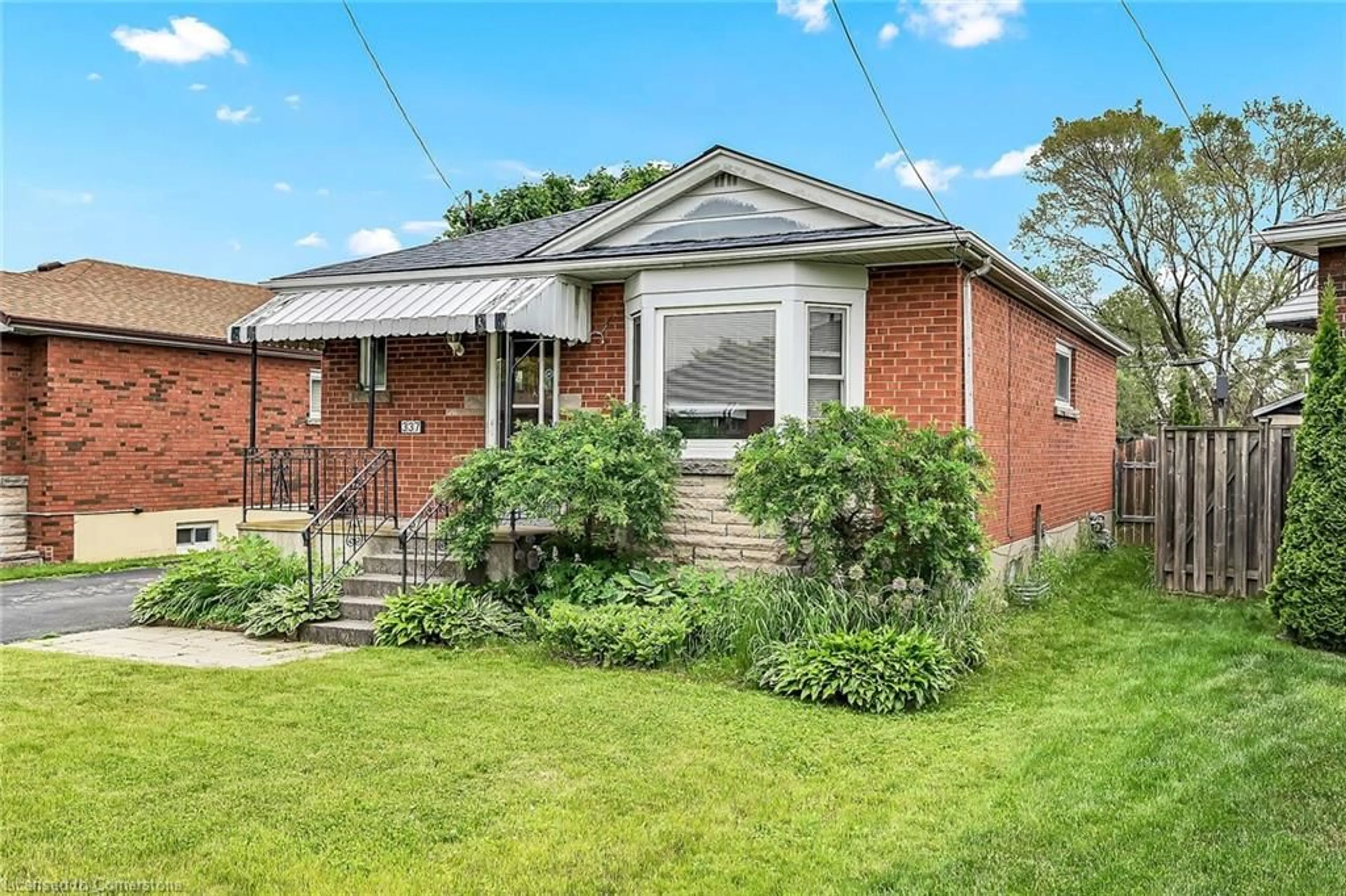 Home with brick exterior material, street for 337 East 33rd St, Hamilton Ontario L8V 3T9