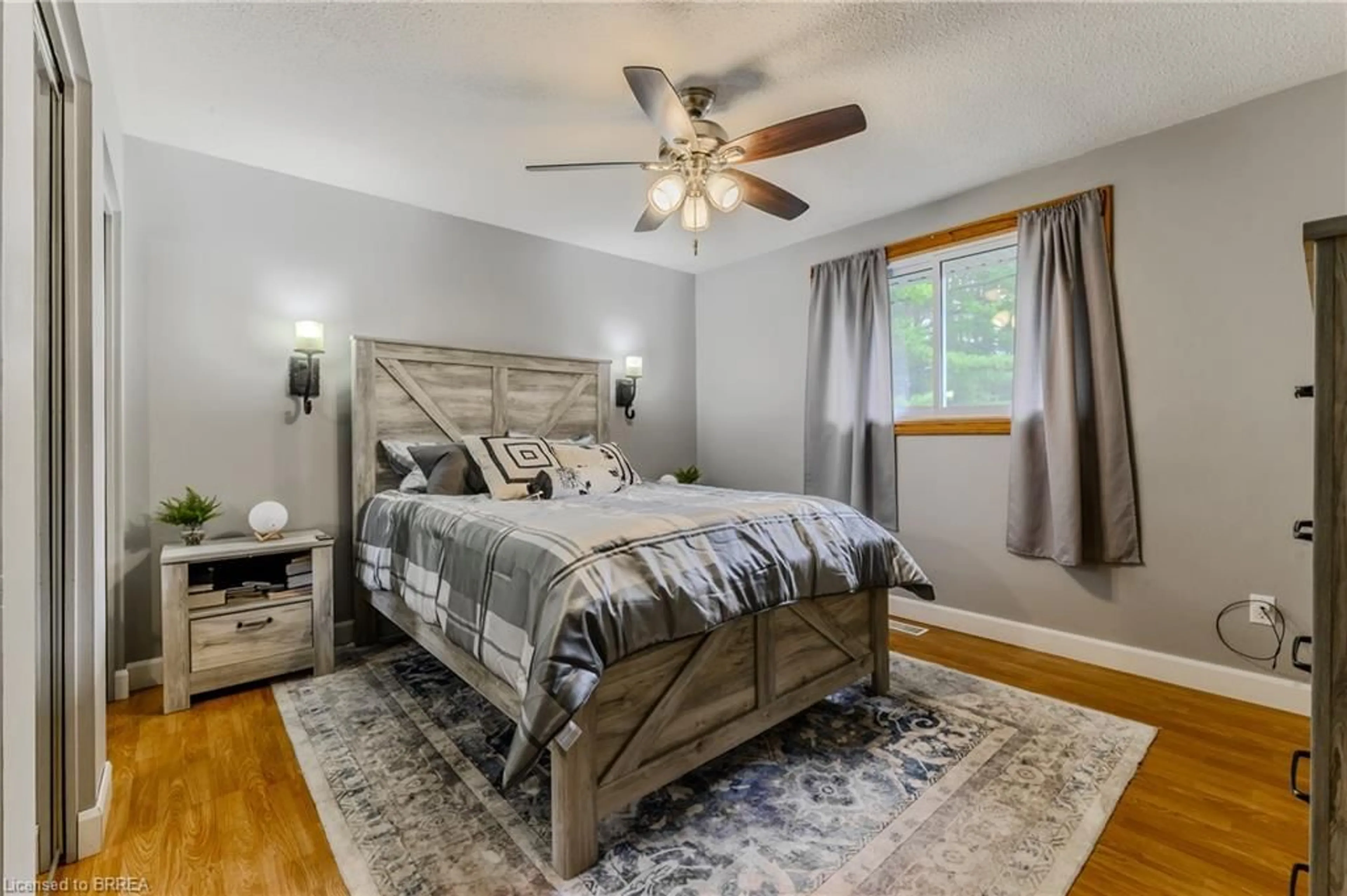 Bedroom with bed, wood/laminate floor for 936 Windham 11 Rd, Delhi Ontario N0E 2A0