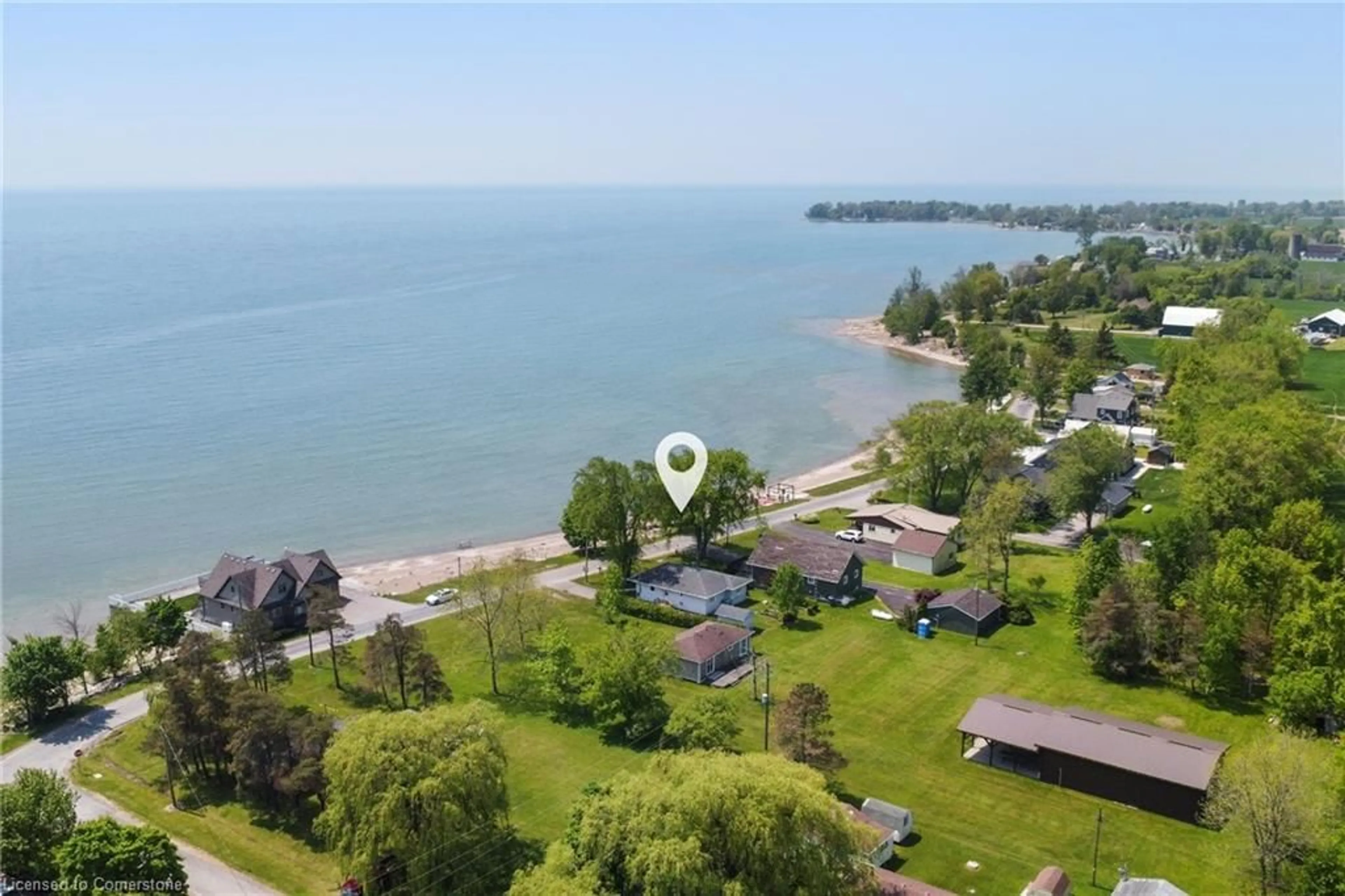 A pic from outside/outdoor area/front of a property/back of a property/a pic from drone, water/lake/river/ocean view for 1351 Lakeshore Rd, Rainham Ontario N0A 1P0