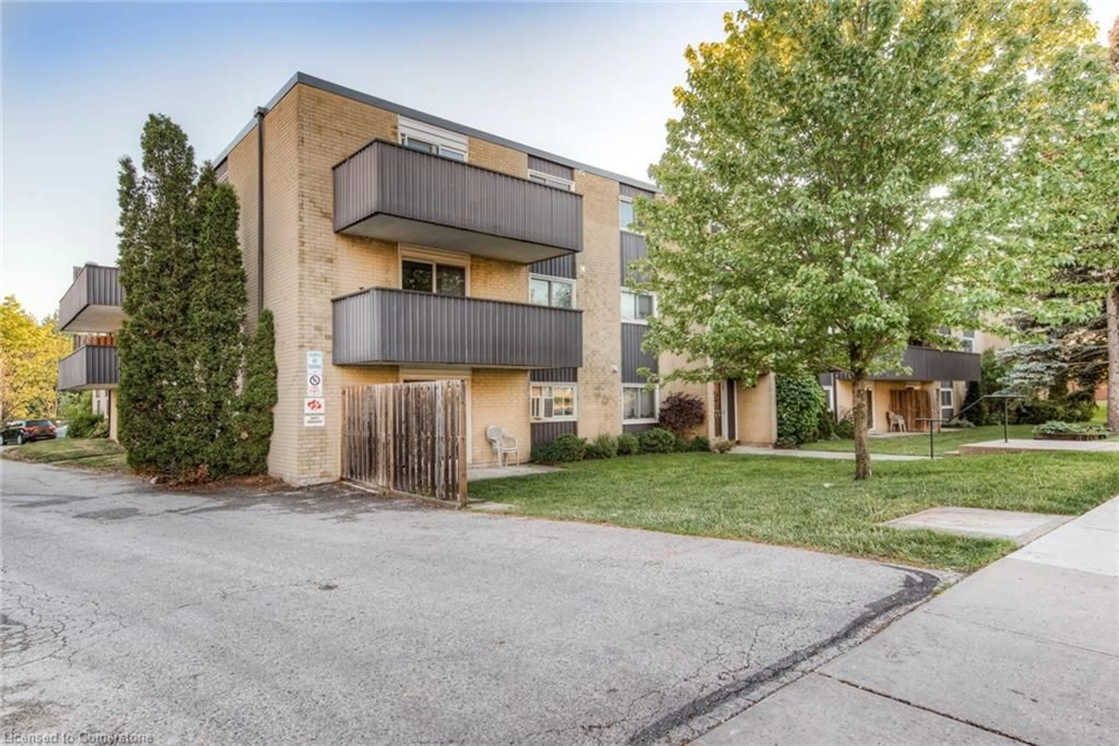 Home with brick exterior material, street for 75 Hazelglen Dr #302, Kitchener Ontario N2M 2E2