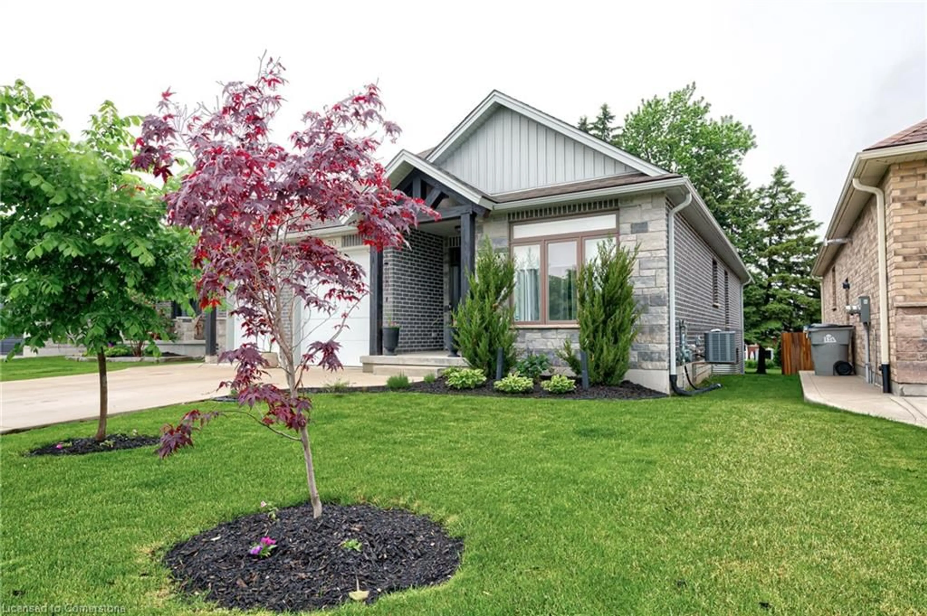 Home with vinyl exterior material, street for 70 Gerber Dr, Milverton Ontario N0K 1M0