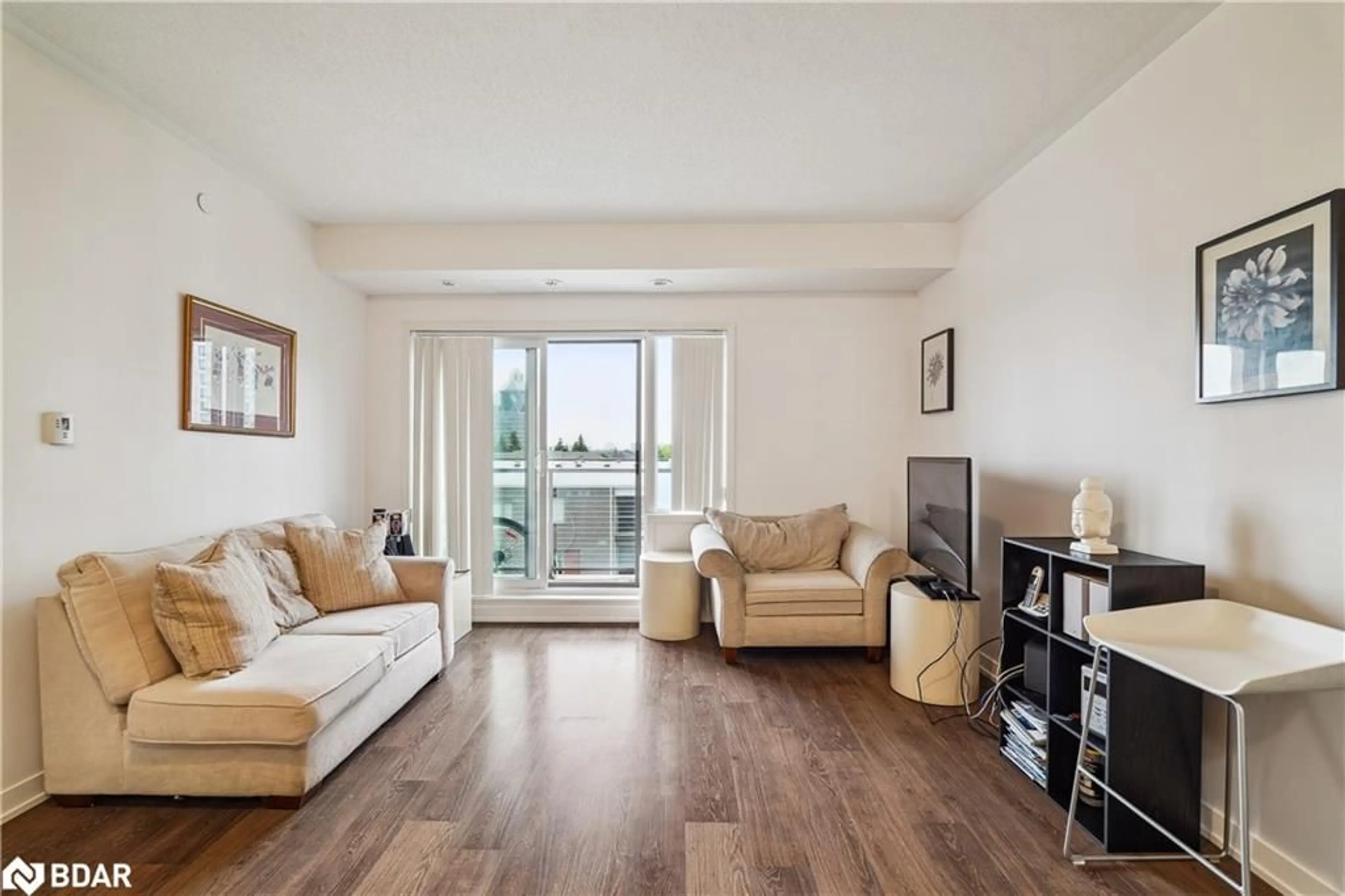 Living room with furniture, wood/laminate floor for 5155 Sheppard Ave #410, Toronto Ontario M1B 0C8