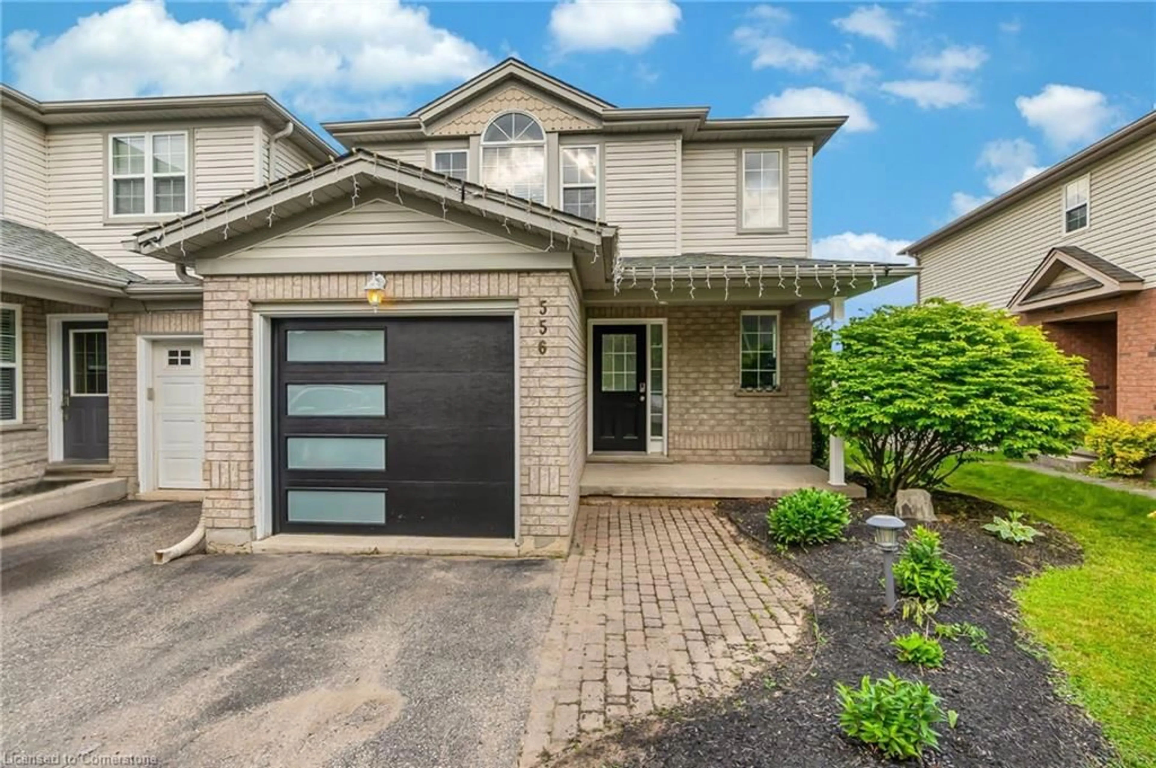 Home with brick exterior material, street for 556 Dansbury Dr, Waterloo Ontario N2K 4E2