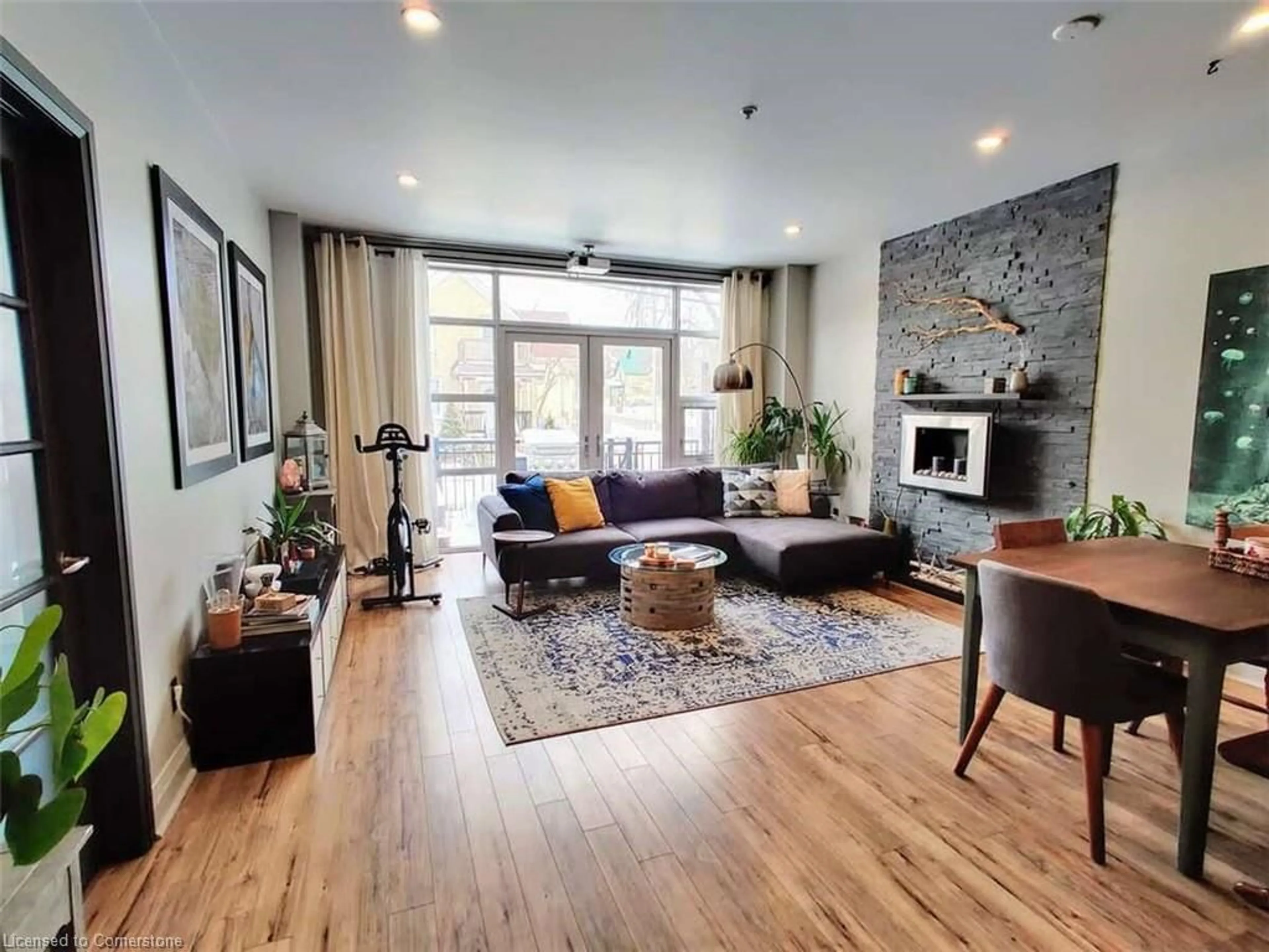 Living room with furniture, wood/laminate floor for 165 Duke St #103, Kitchener Ontario N2H 6T8