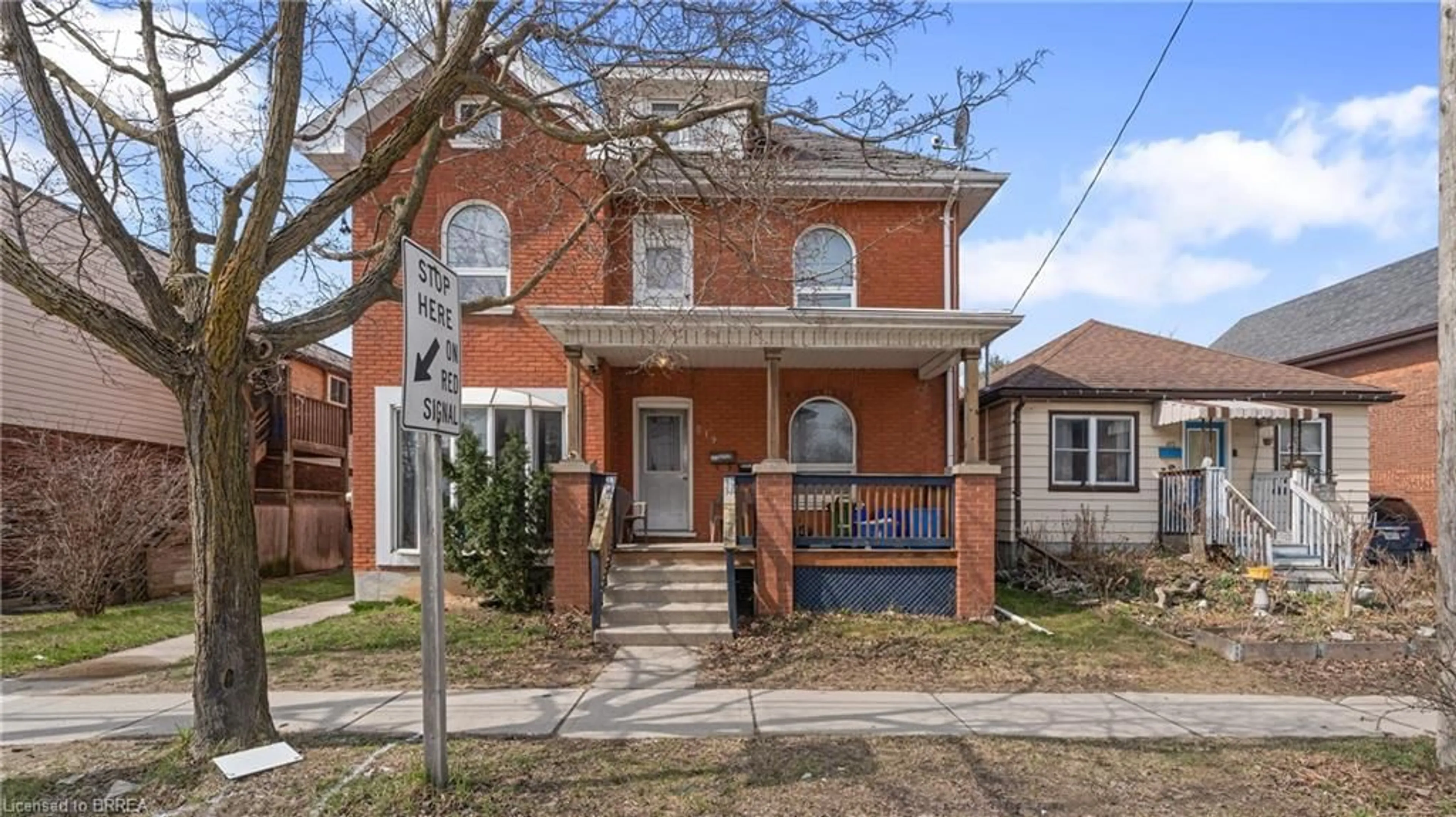Home with brick exterior material, street for 219 Erie Ave, Brantford Ontario N3S 2H1