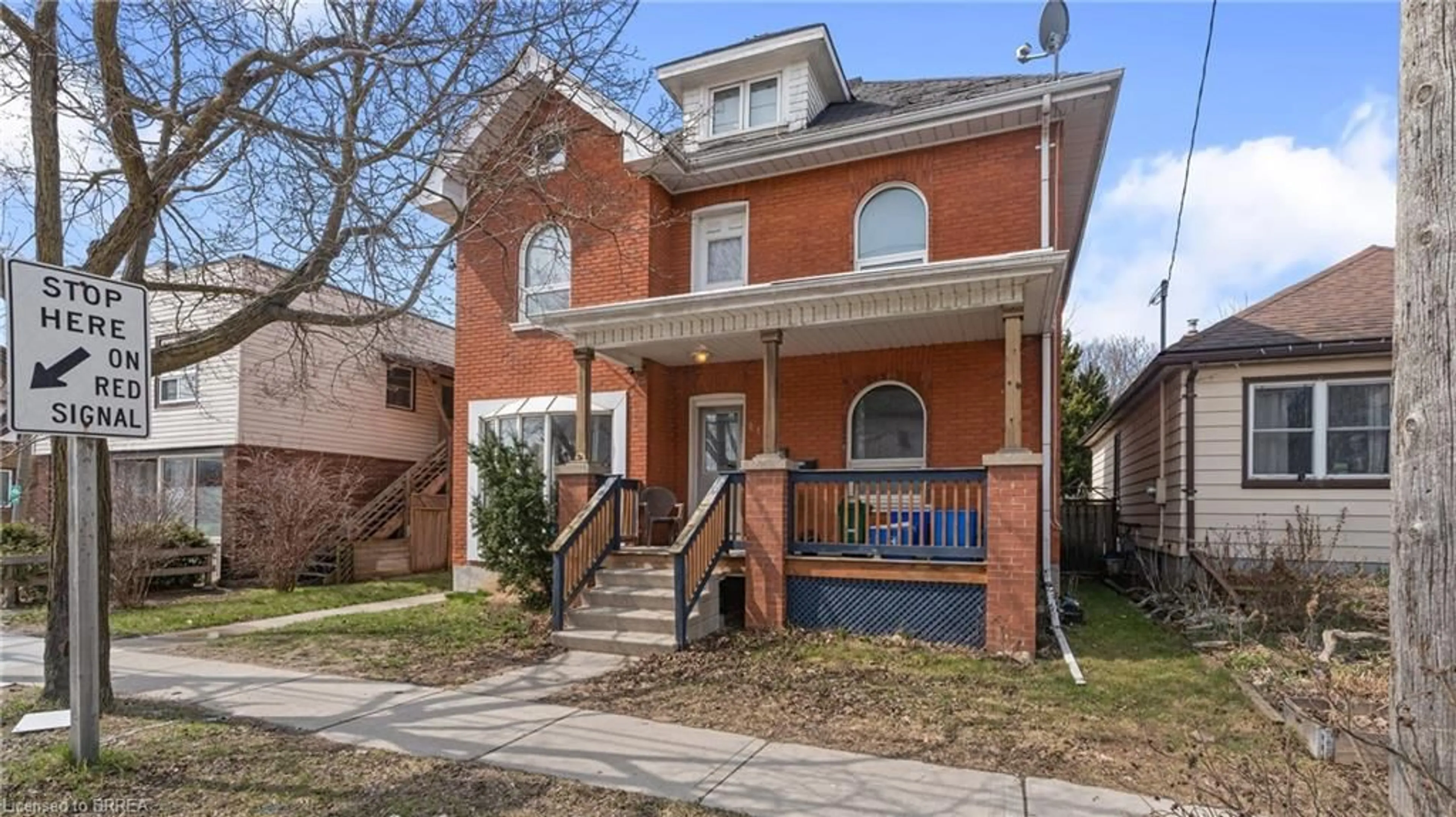 Home with brick exterior material, street for 219 Erie Ave, Brantford Ontario N3S 2H1