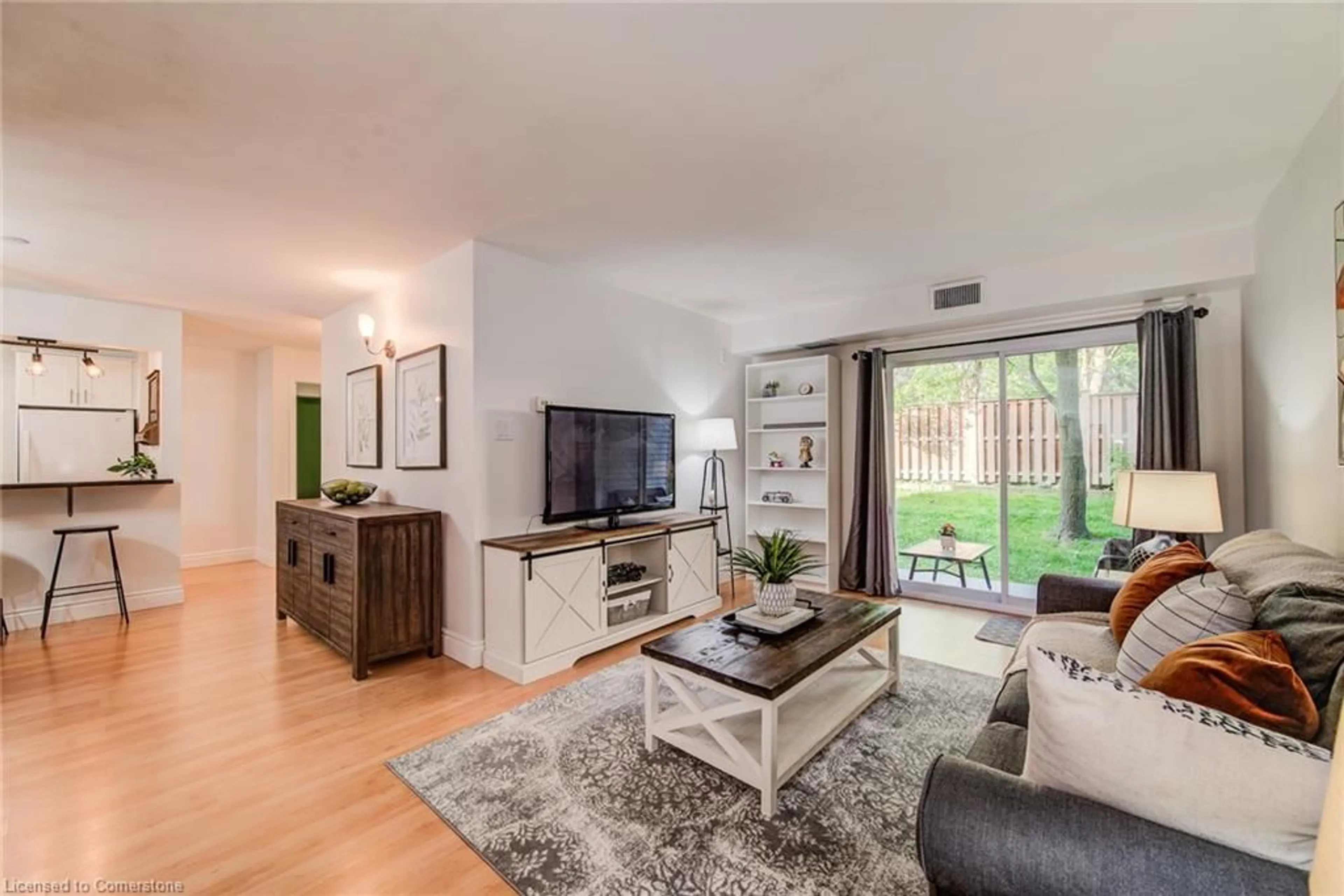 Living room with furniture, wood/laminate floor for 500 Westmount St #205, Kitchener Ontario N2M 5M9