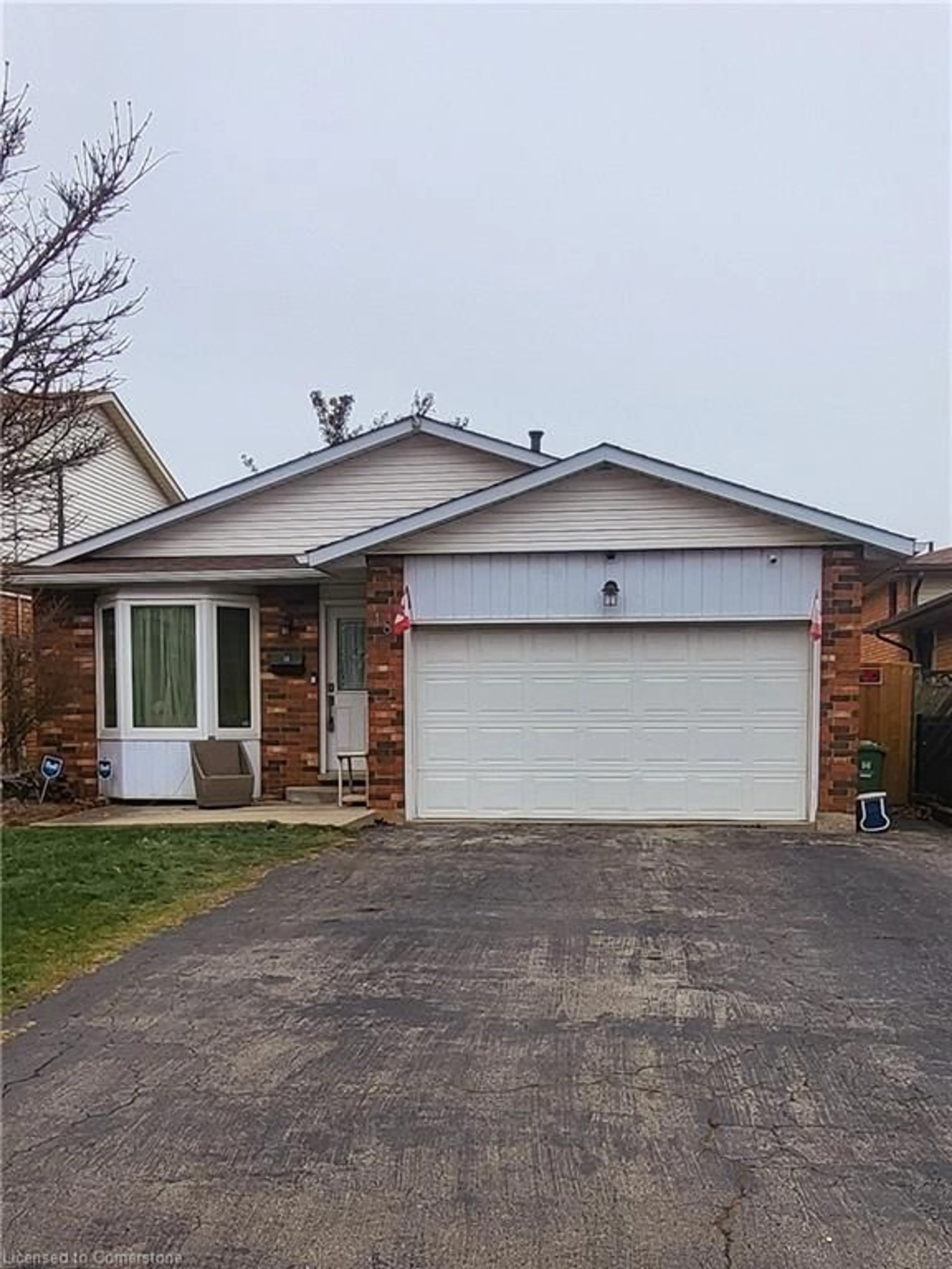 Home with brick exterior material, street for 18 Rosewell St, Hamilton Ontario L8W 2L1