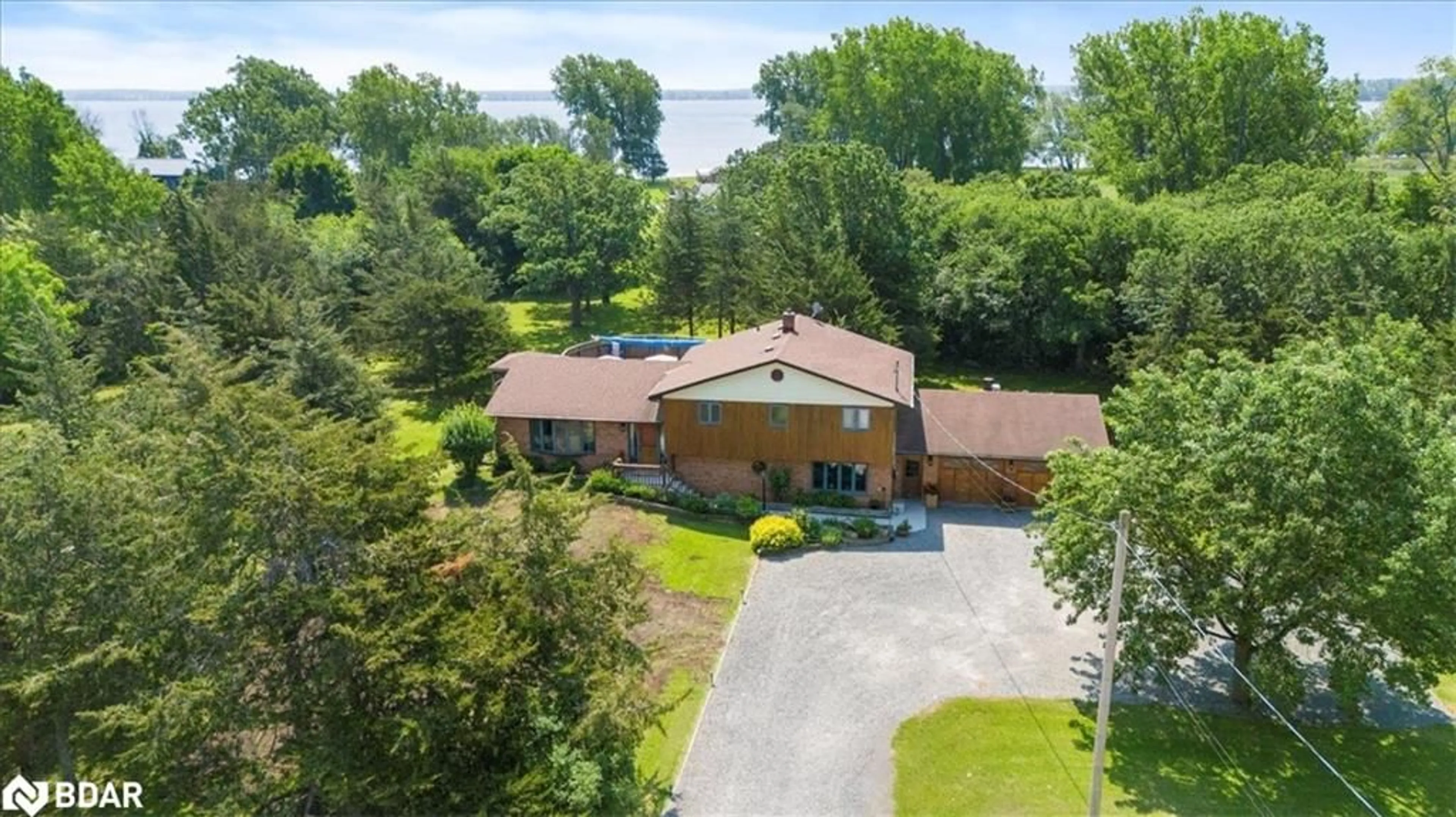A pic from outside/outdoor area/front of a property/back of a property/a pic from drone, water/lake/river/ocean view for 338 Sunrise Dr Dr, Prince Edward County Ontario K8N 4Z7