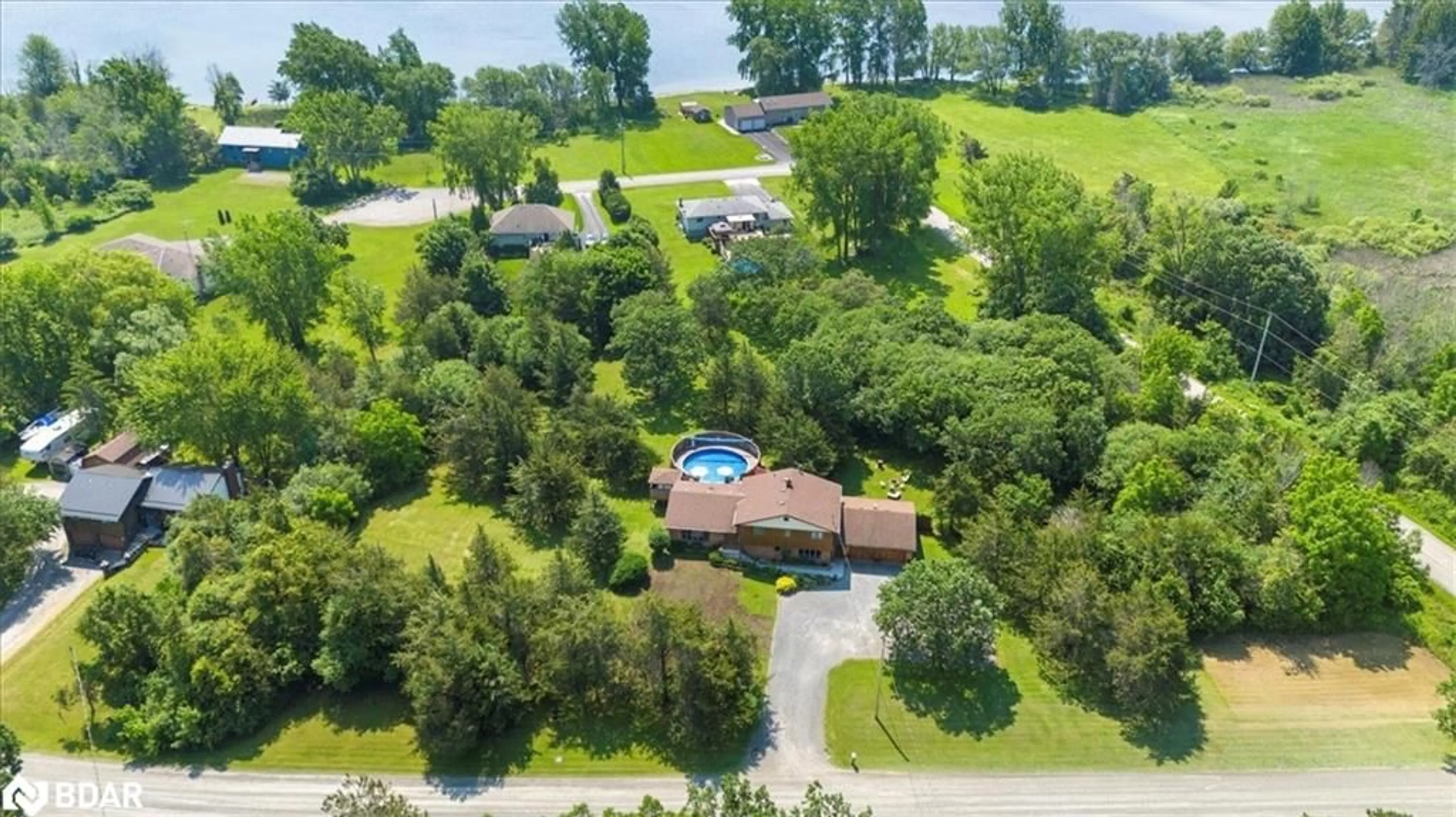 A pic from outside/outdoor area/front of a property/back of a property/a pic from drone, water/lake/river/ocean view for 338 Sunrise Dr Dr, Prince Edward County Ontario K8N 4Z7