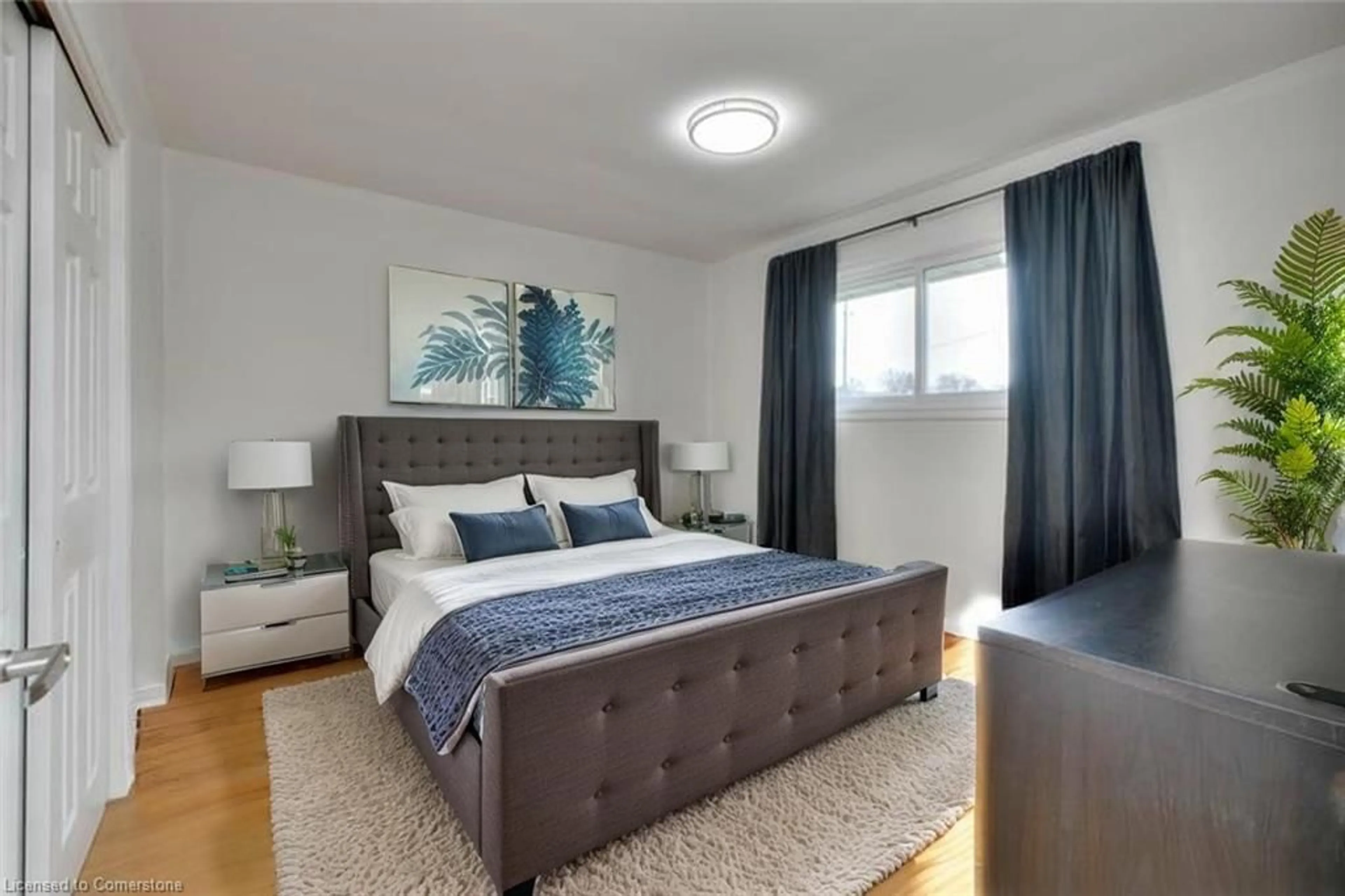 Bedroom with bed, wood/laminate floor for 484 Speedvale Ave, Guelph Ontario N1E 1P2