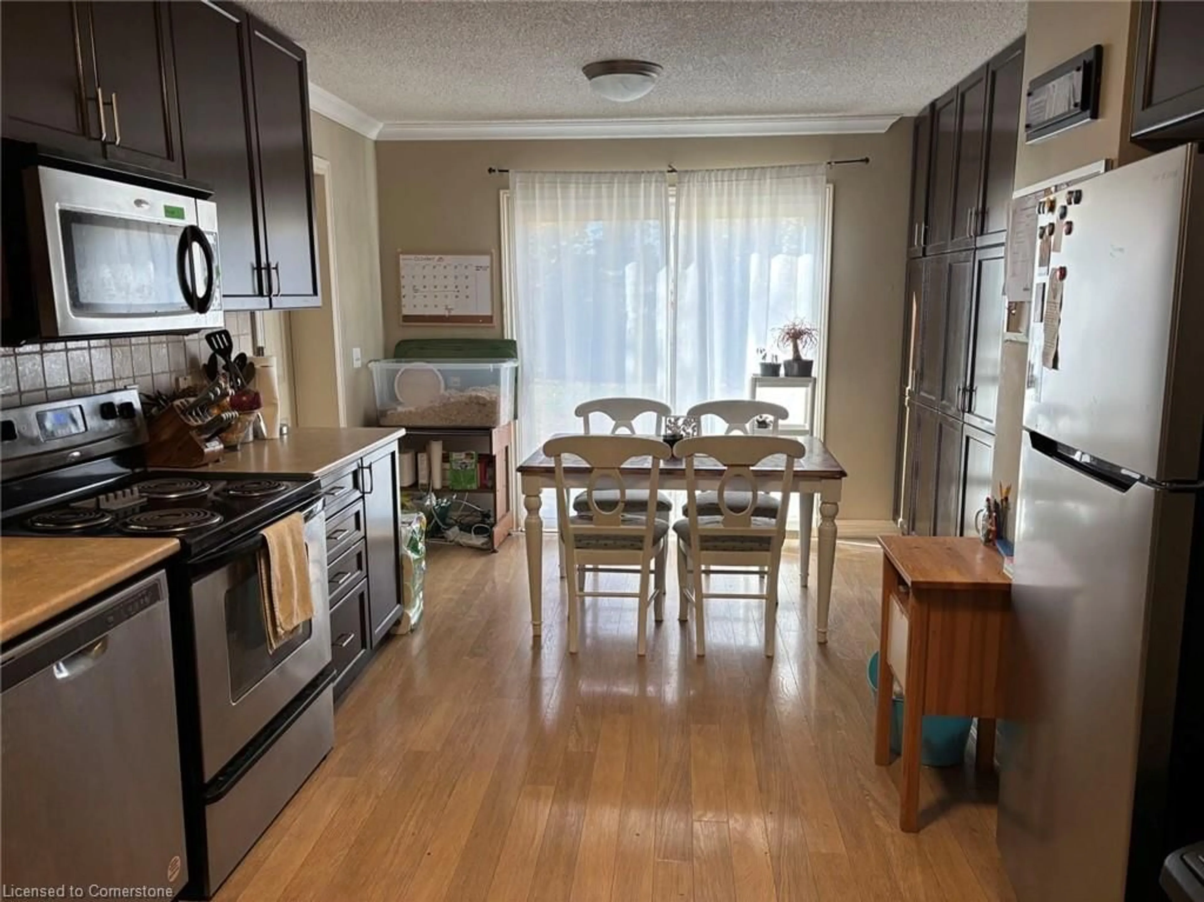 Open concept kitchen, wood/laminate floor for 121 University Ave #83, Waterloo Ontario N2J 4J1