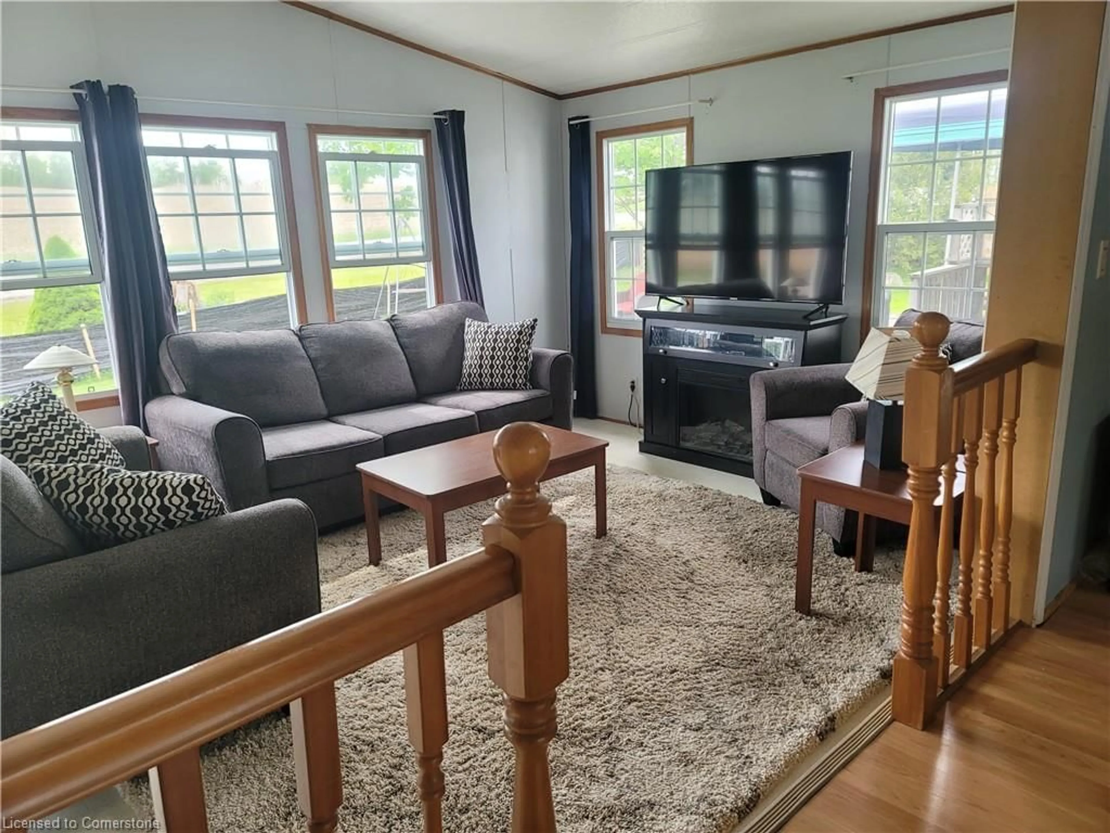 Living room with furniture, wood/laminate floor for 580 Beaver Creek Rd #62, Waterloo Ontario N2J 3Z4