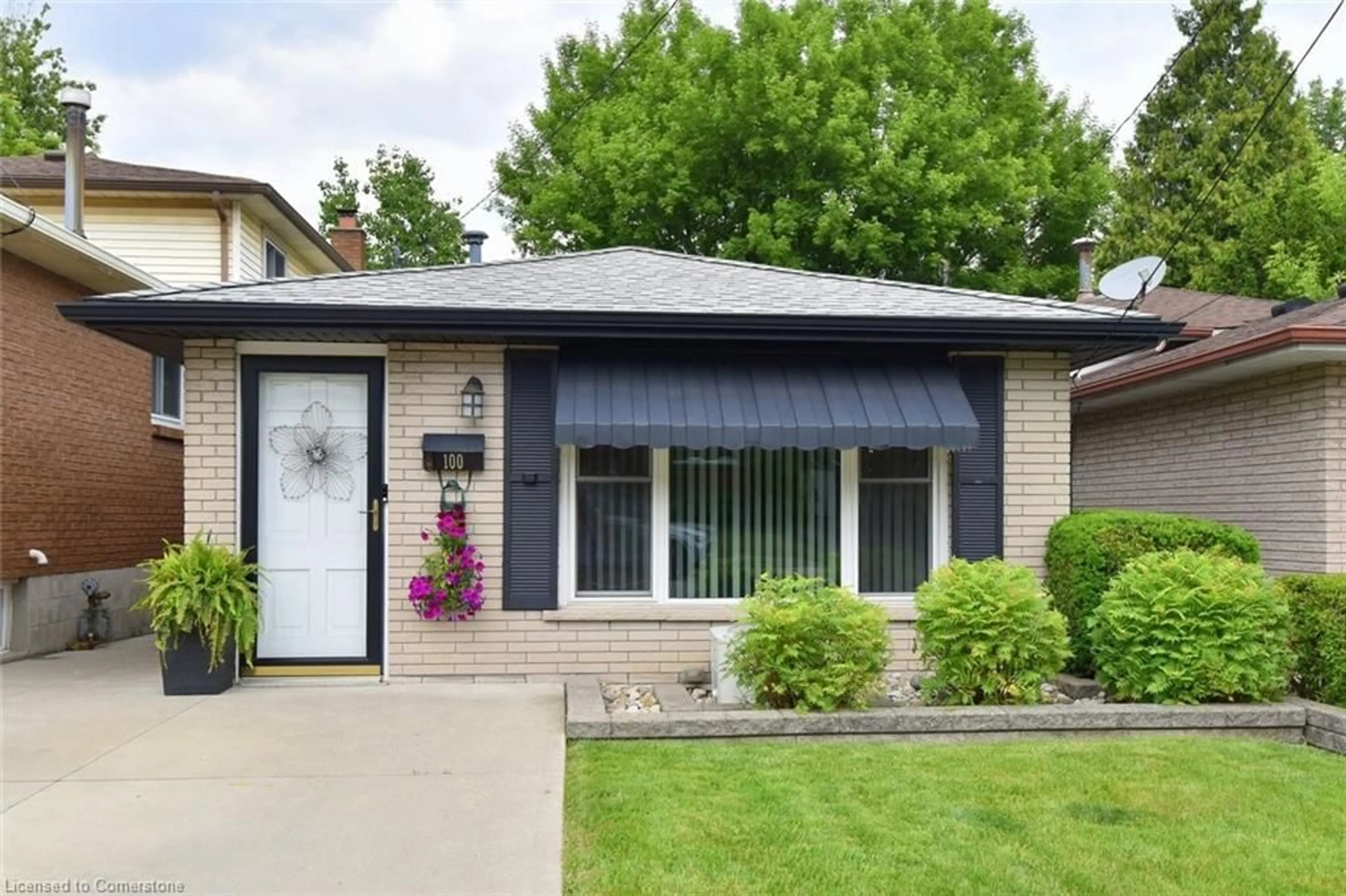 Home with vinyl exterior material, street for 100 Whitney Ave, Hamilton Ontario L8S 2G5