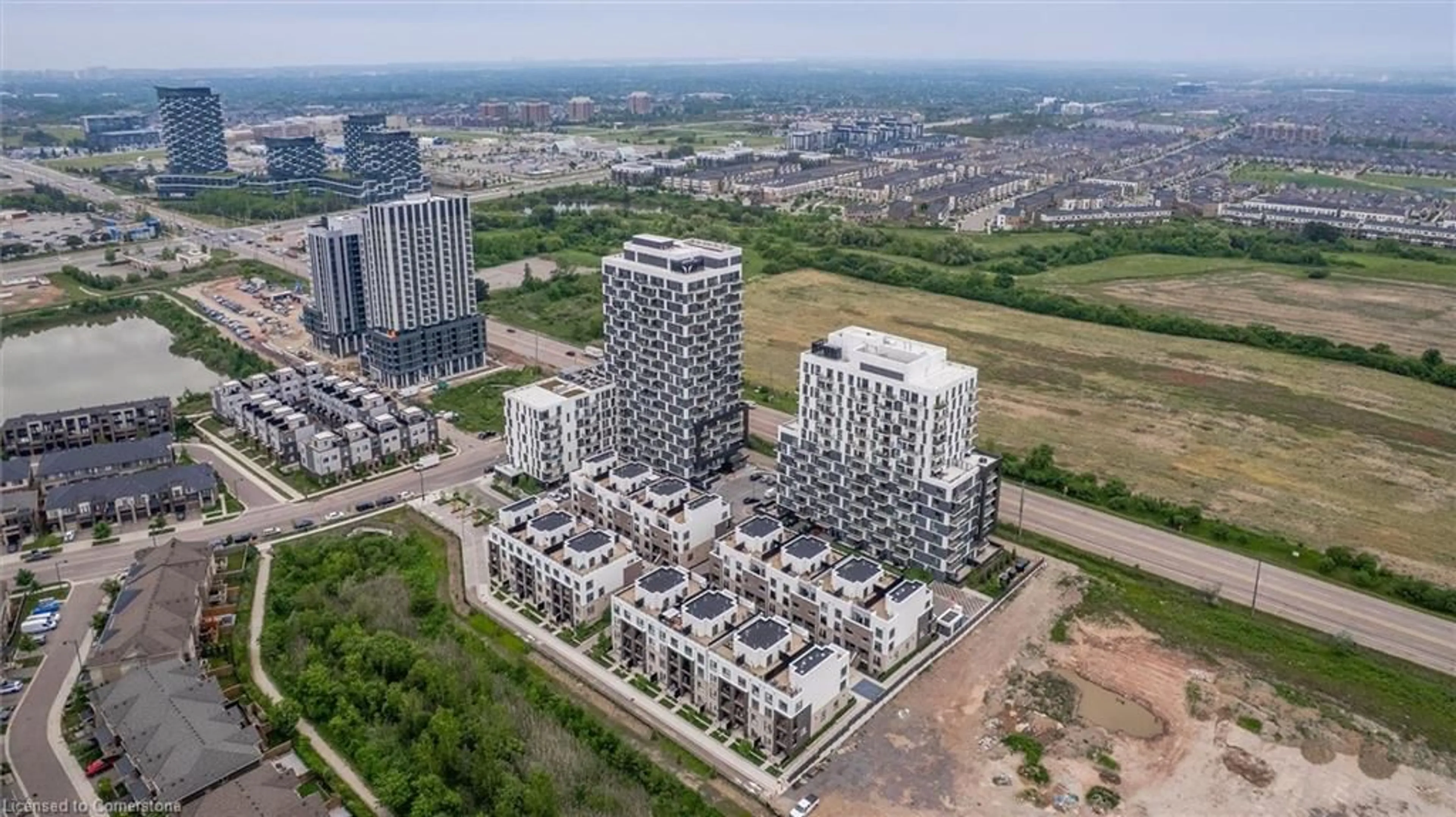 A pic from outside/outdoor area/front of a property/back of a property/a pic from drone, city buildings view from balcony for 335 Wheat Boom Dr #1210, Oakville Ontario L6H 7Y1