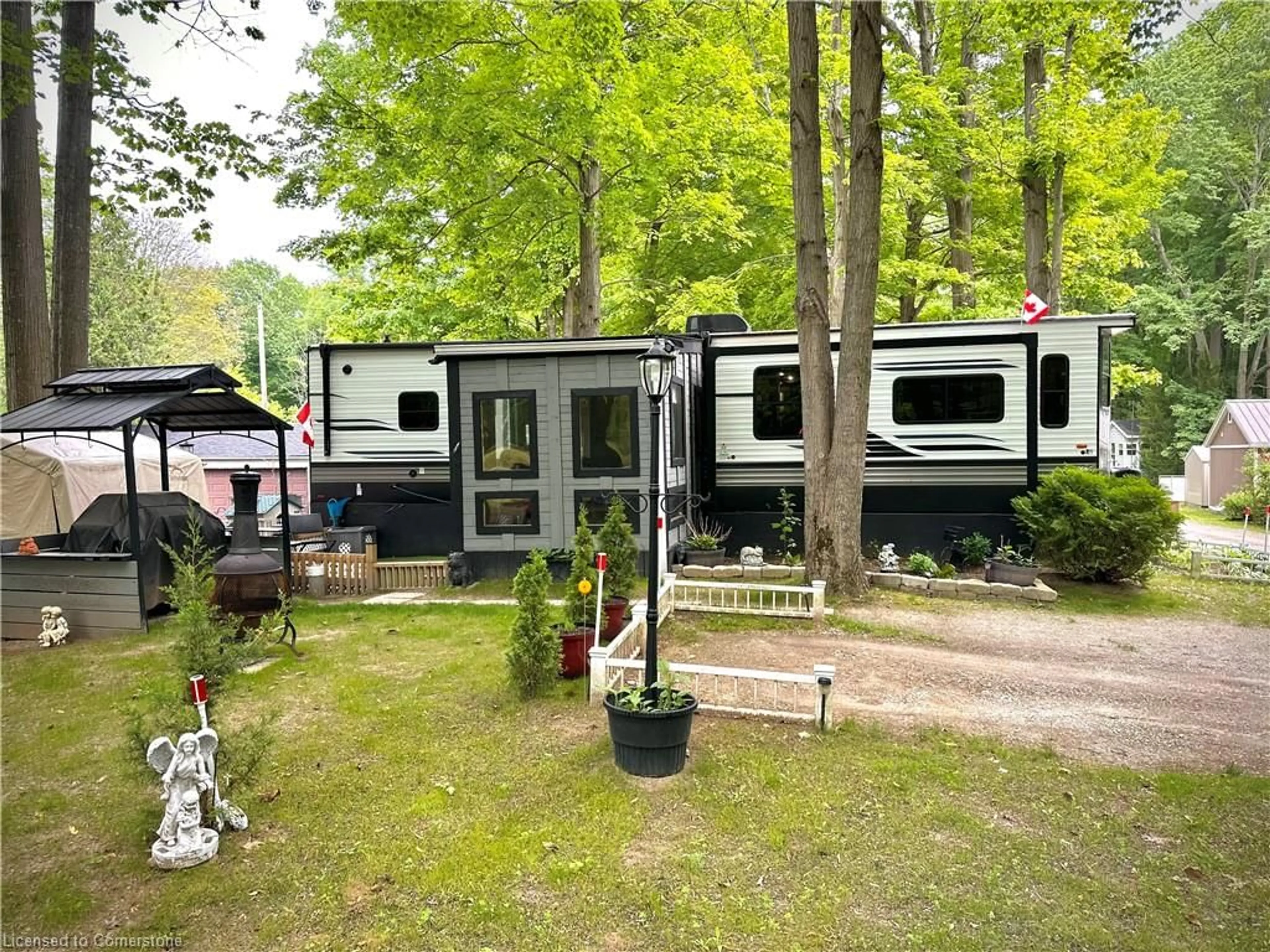 Home with vinyl exterior material, forest/trees view for 334 Rattlesnake Rd #53, Lowbanks Ontario N0A 1K0