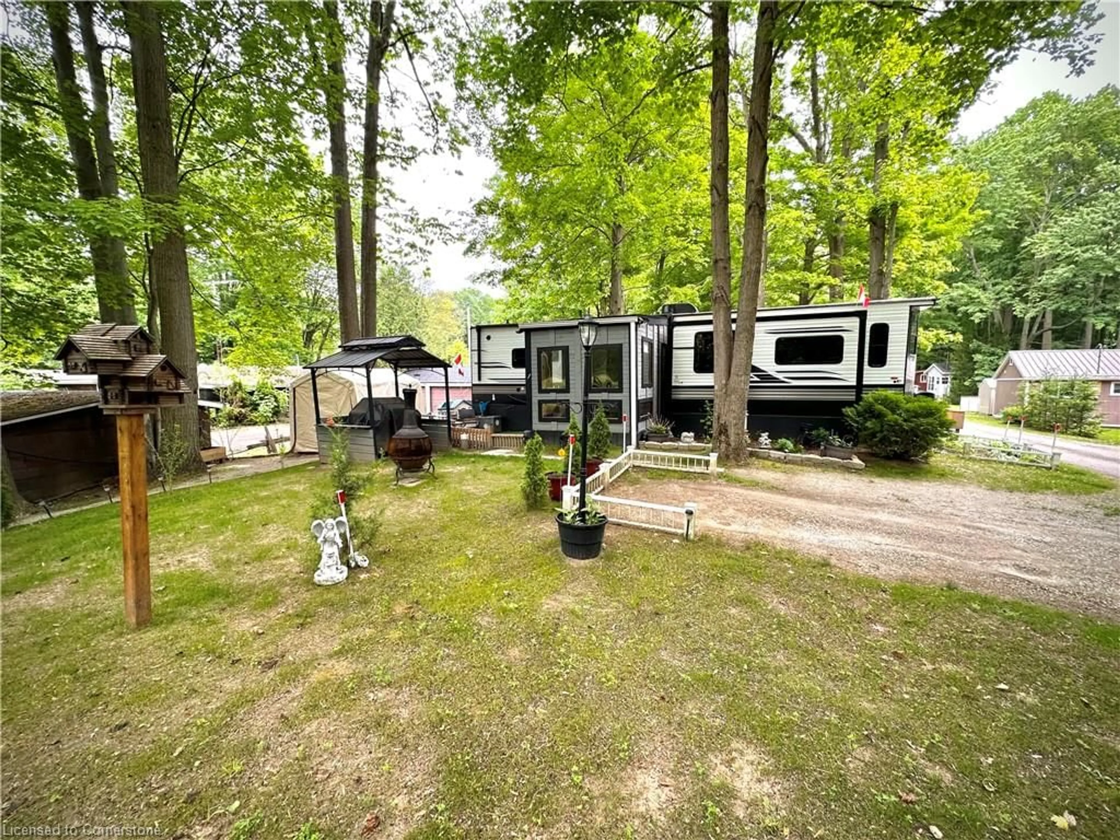 A pic from outside/outdoor area/front of a property/back of a property/a pic from drone, forest/trees view for 334 Rattlesnake Rd #53, Lowbanks Ontario N0A 1K0