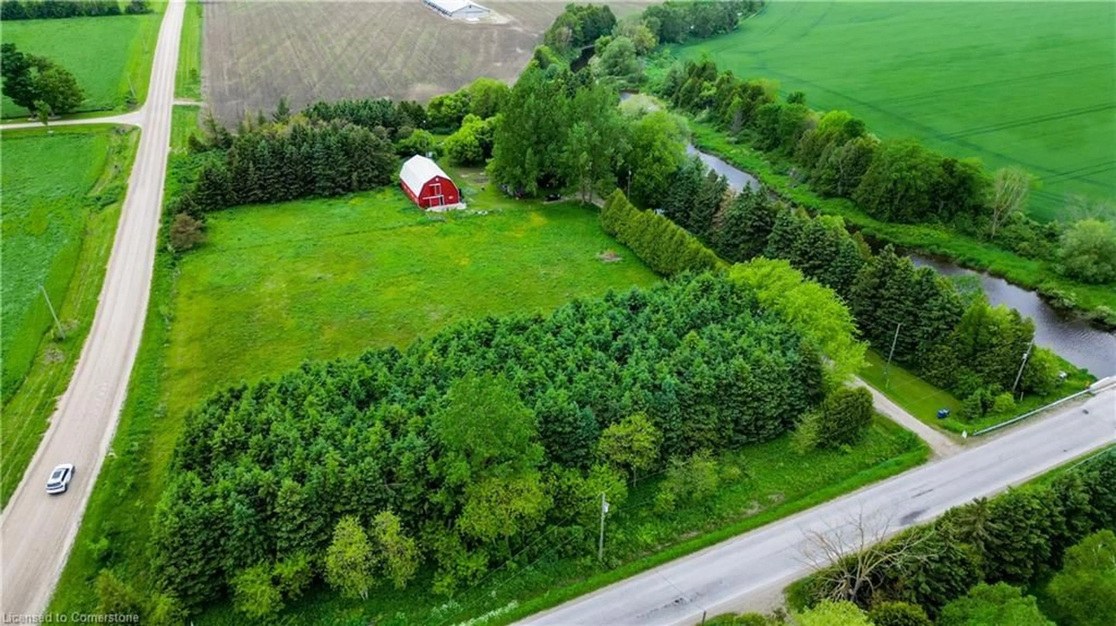 A pic from outside/outdoor area/front of a property/back of a property/a pic from drone, forest/trees view for 031424 Southgate Side Road 3, Southgate Ontario N0G 2L0