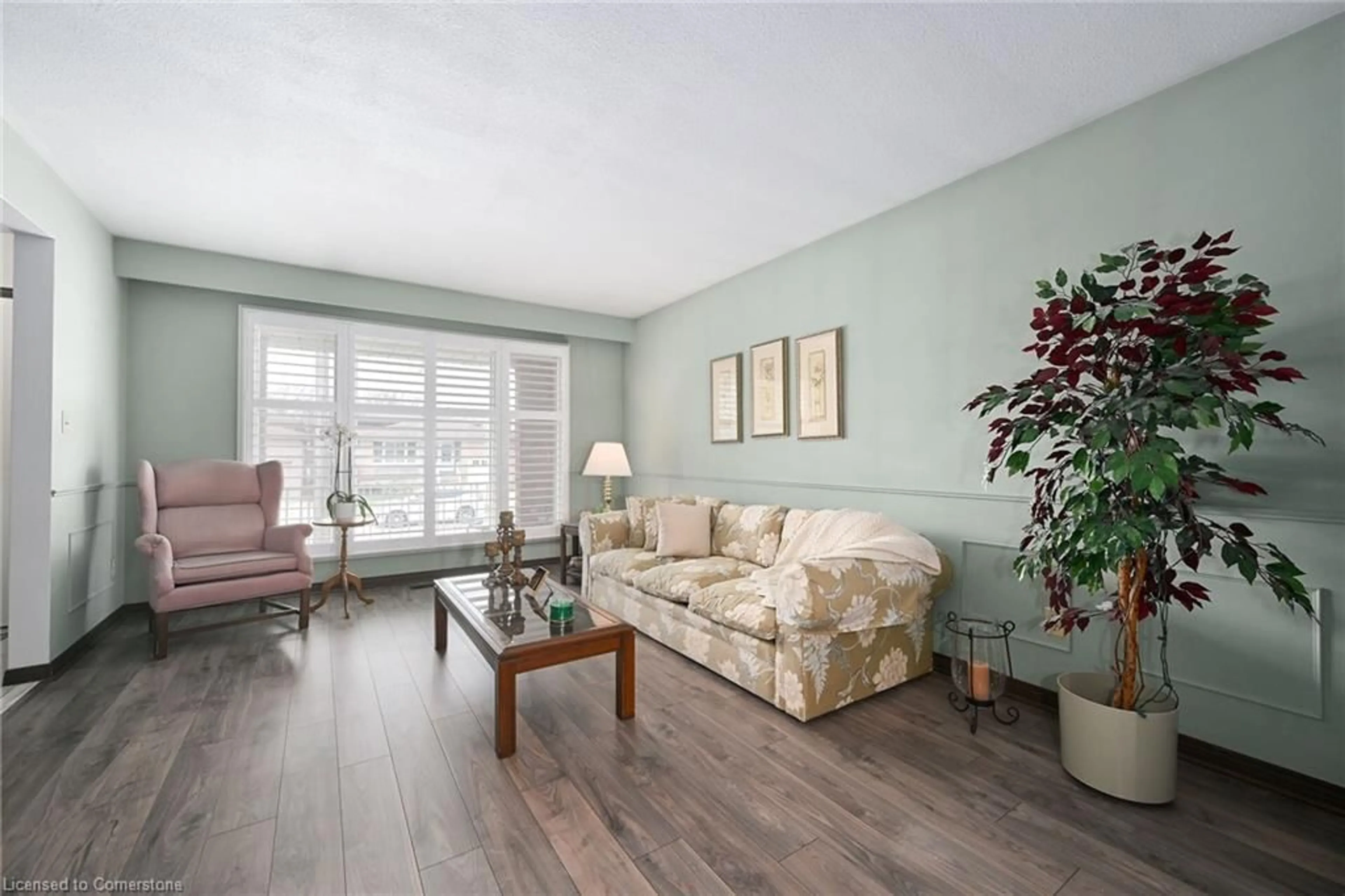 Living room with furniture, wood/laminate floor for 345 Carson Dr, Hamilton Ontario L8T 4T7