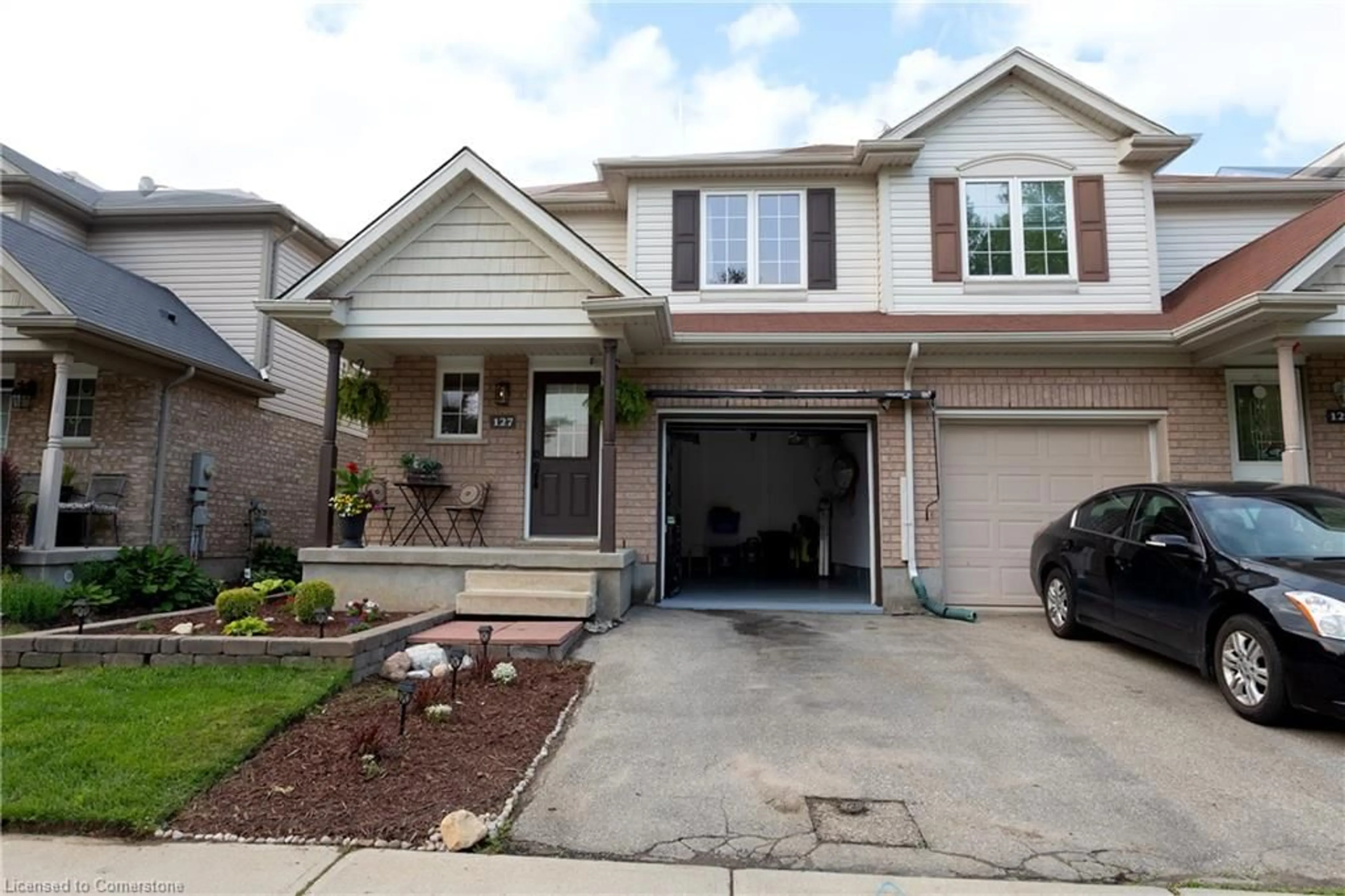 Home with vinyl exterior material, street for 127 Sims Estate Dr, Kitchener Ontario N2A 0A6