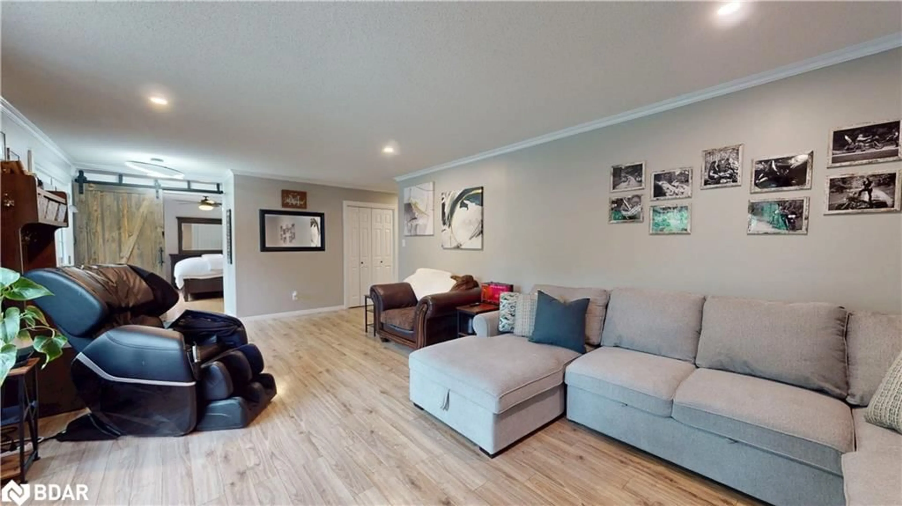 Living room with furniture, wood/laminate floor for 4557 Trent Trail, Washago Ontario L0K 2B0