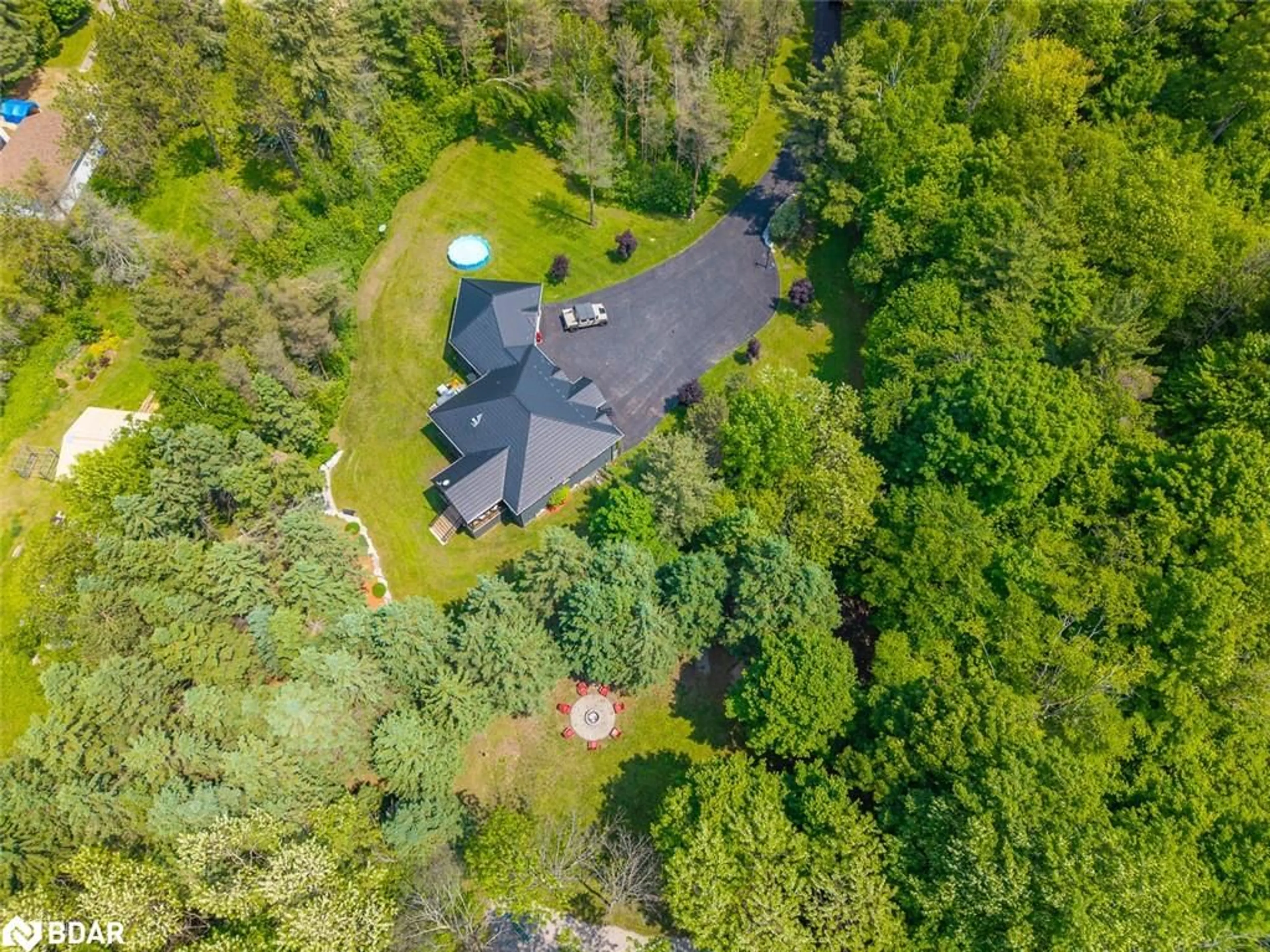 A pic from outside/outdoor area/front of a property/back of a property/a pic from drone, forest/trees view for 7070 93 Hwy, Tiny Ontario L0K 2E0