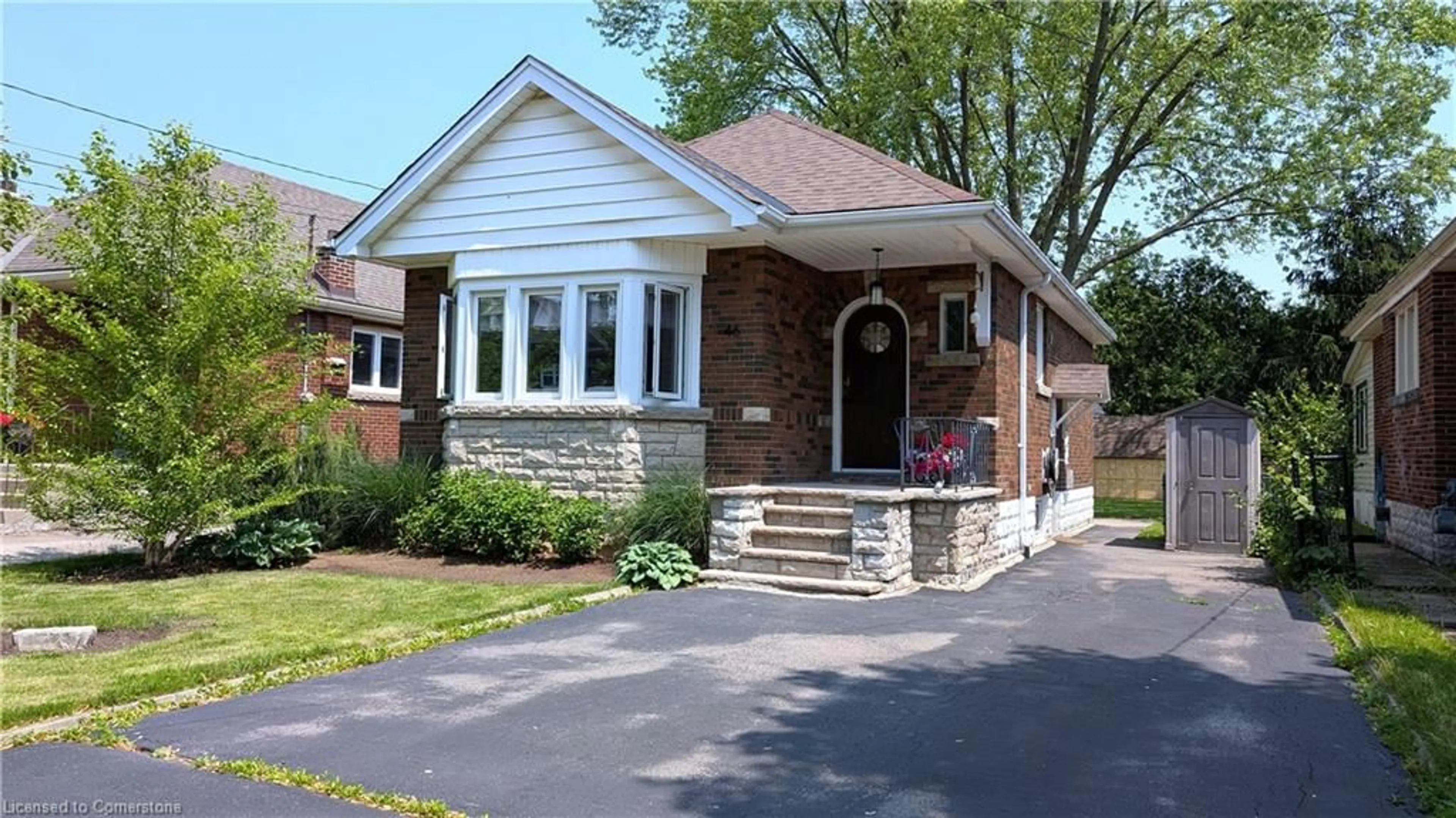 Home with brick exterior material, street for 46 Kenmore Rd, Hamilton Ontario L8S 3T7