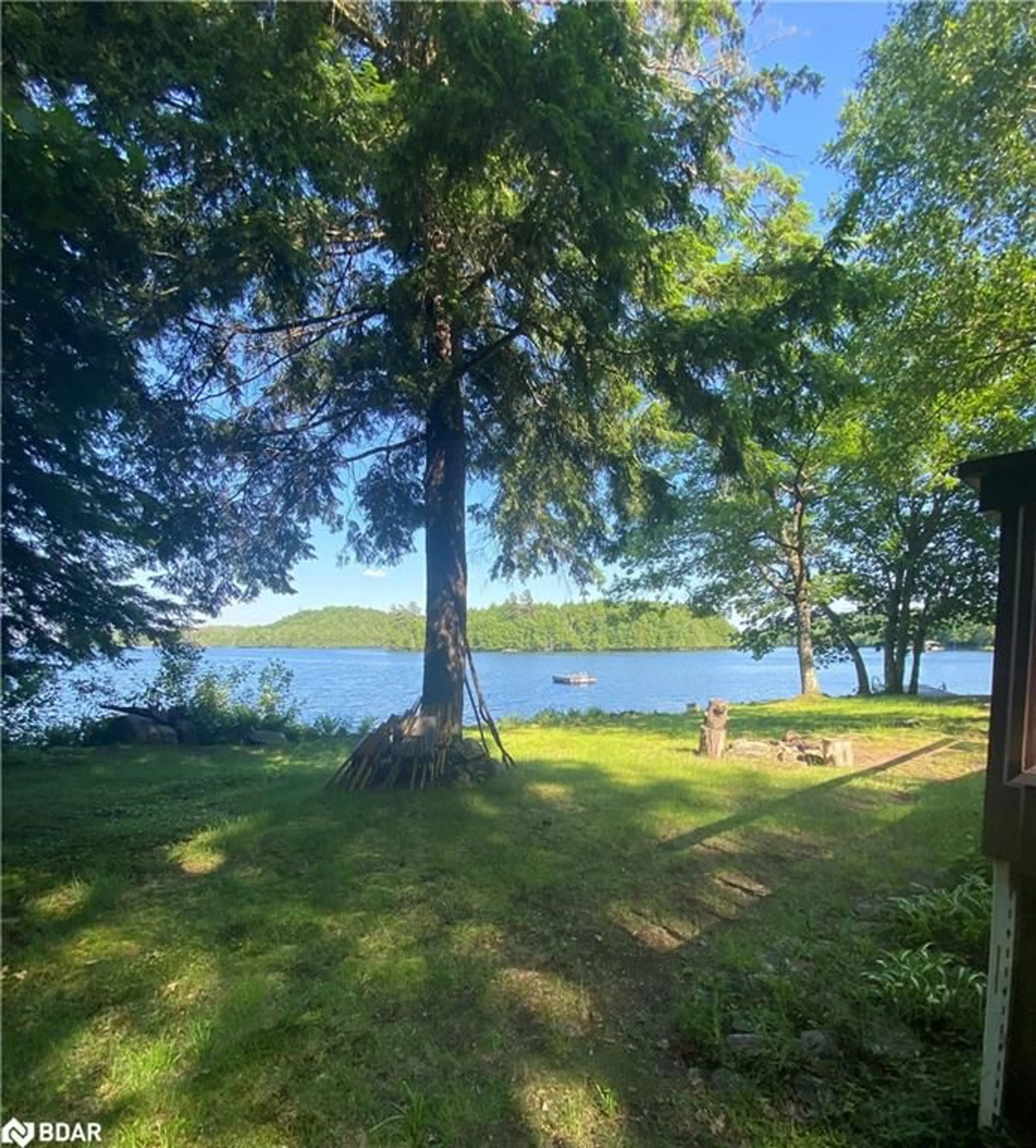A pic from outside/outdoor area/front of a property/back of a property/a pic from drone, water/lake/river/ocean view for 4127 South Portage Rd Rd, Huntsville Ontario P1H 2J3