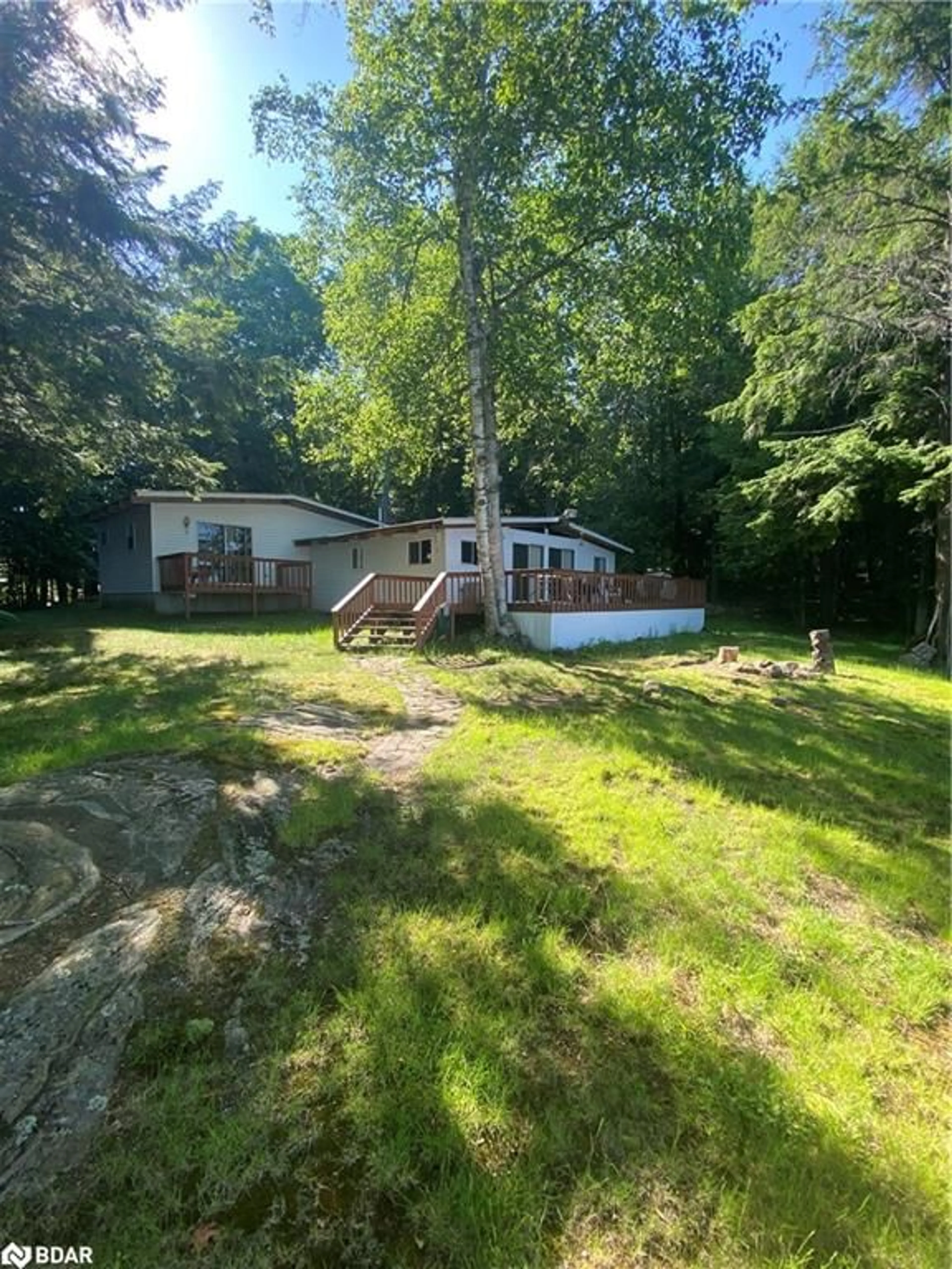 A pic from outside/outdoor area/front of a property/back of a property/a pic from drone, water/lake/river/ocean view for 4127 South Portage Rd Rd, Huntsville Ontario P1H 2J3