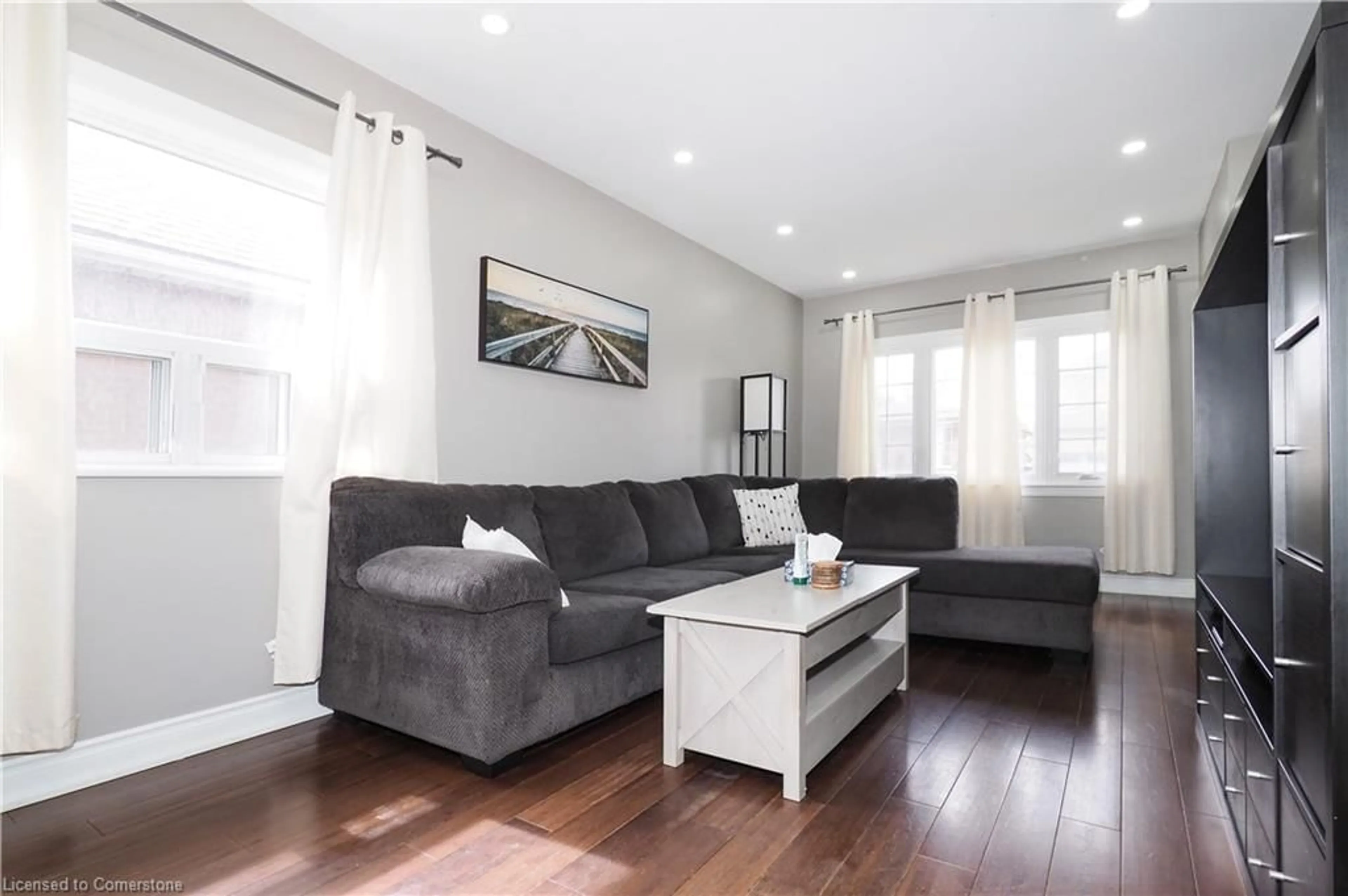 Living room with furniture, wood/laminate floor for 131 Newlands Ave, Hamilton Ontario L8H 2T8