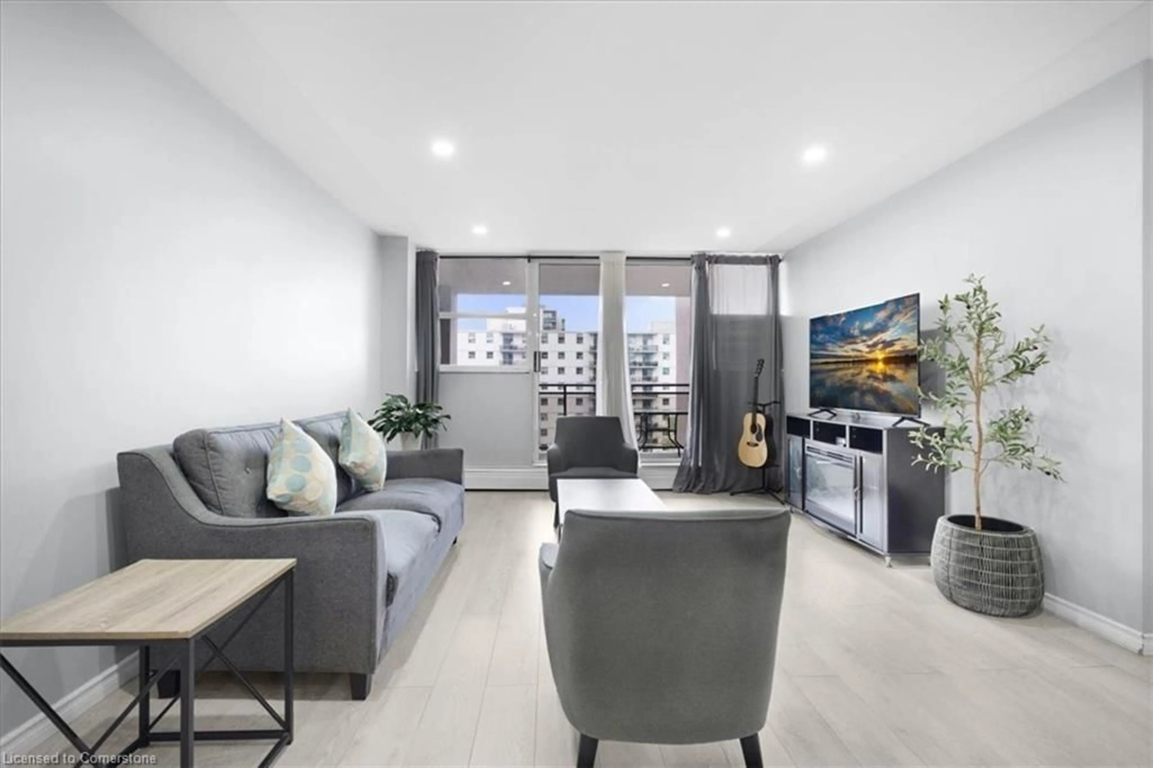 Living room with furniture, cement floor for 975 Warwick Crt #806, Burlington Ontario L7T 3Z7