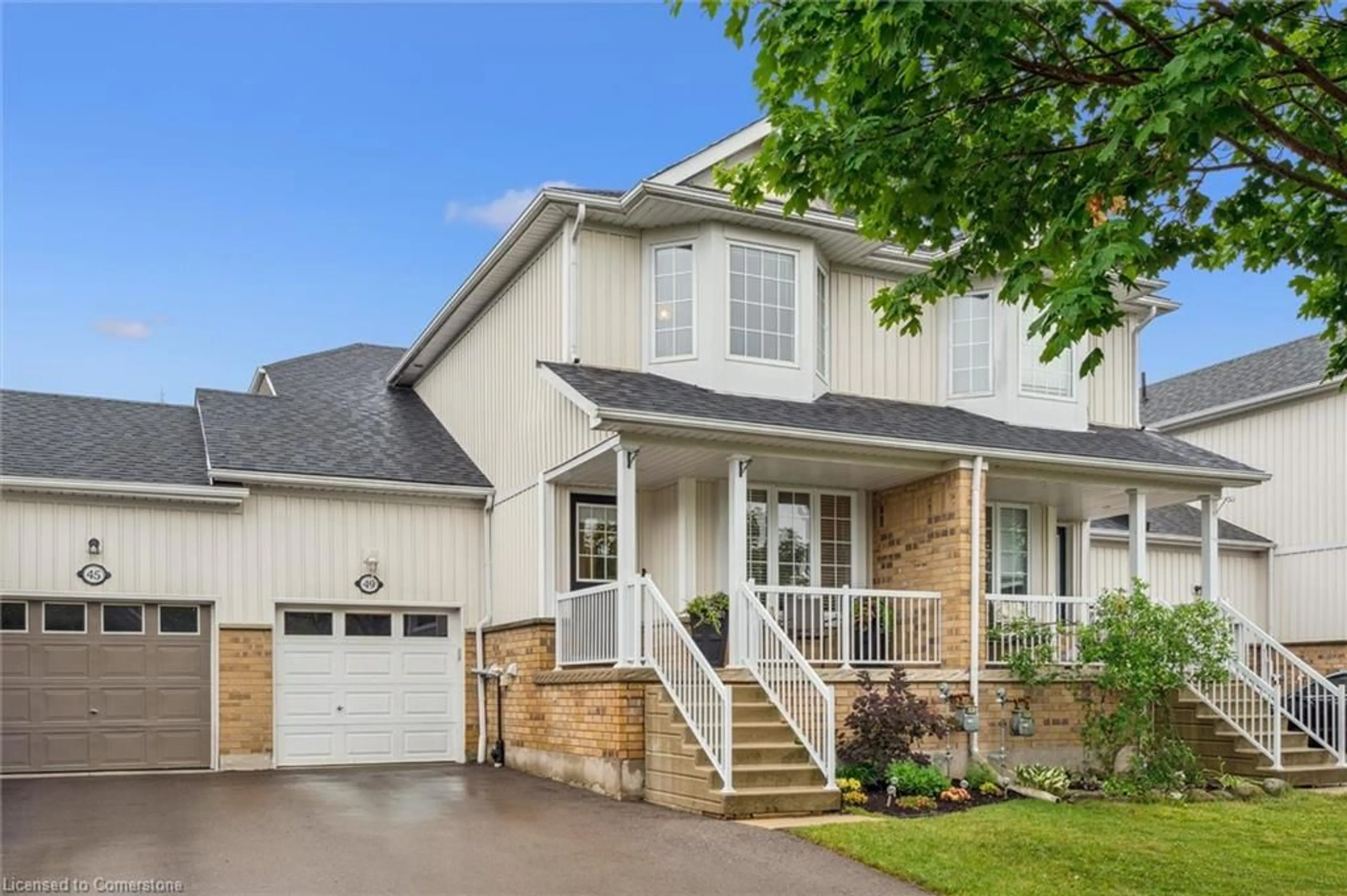 Home with vinyl exterior material, street for 49 Porchlight Dr, Elmira Ontario N3B 3M7