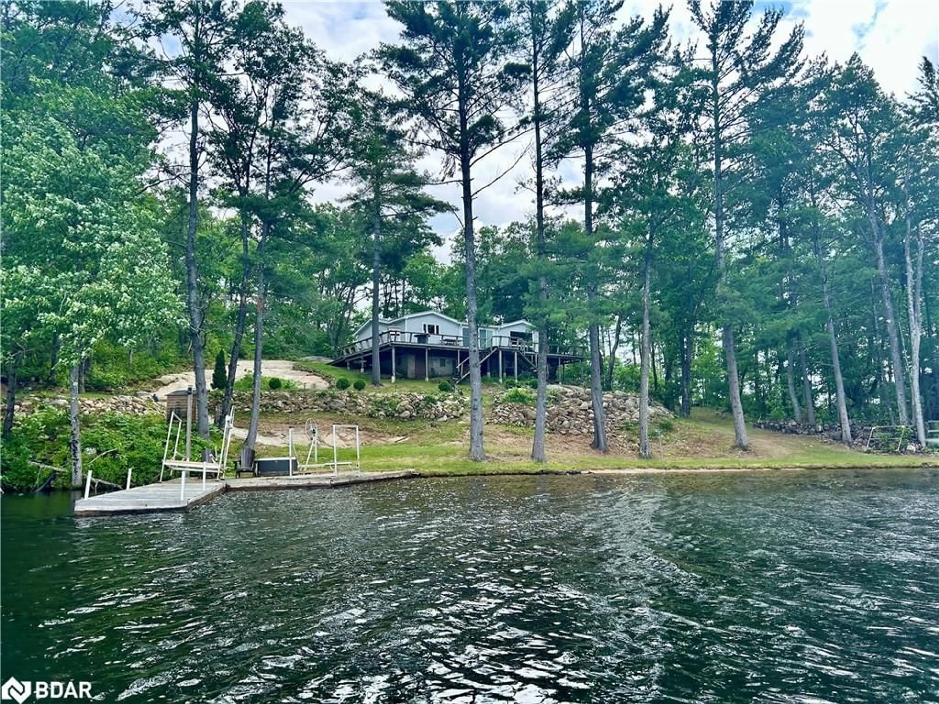 A pic from outside/outdoor area/front of a property/back of a property/a pic from drone, water/lake/river/ocean view for 385 Island 38, Havelock Ontario K0L 2H0