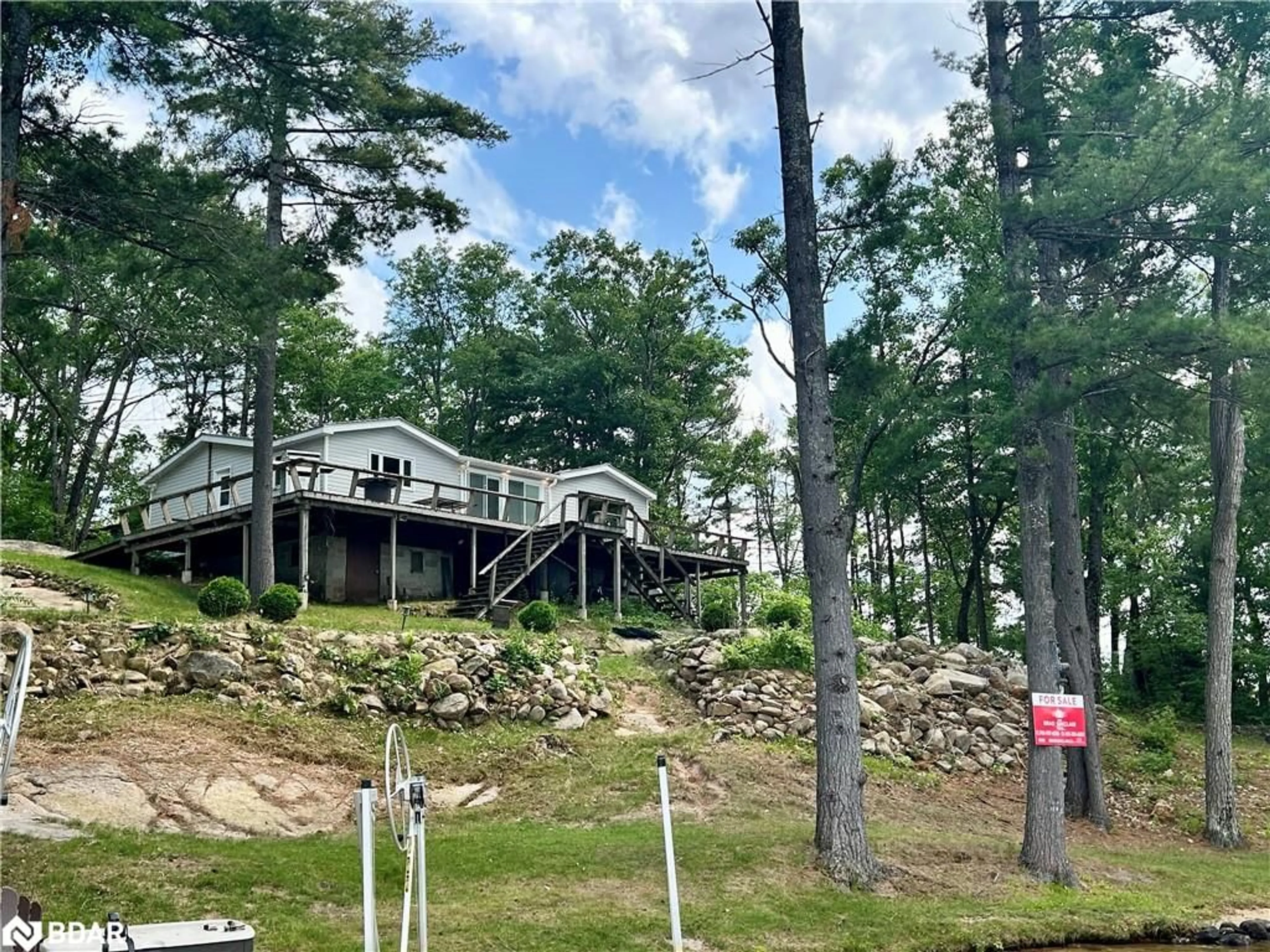 A pic from outside/outdoor area/front of a property/back of a property/a pic from drone, forest/trees view for 385 Island 38, Havelock Ontario K0L 2H0