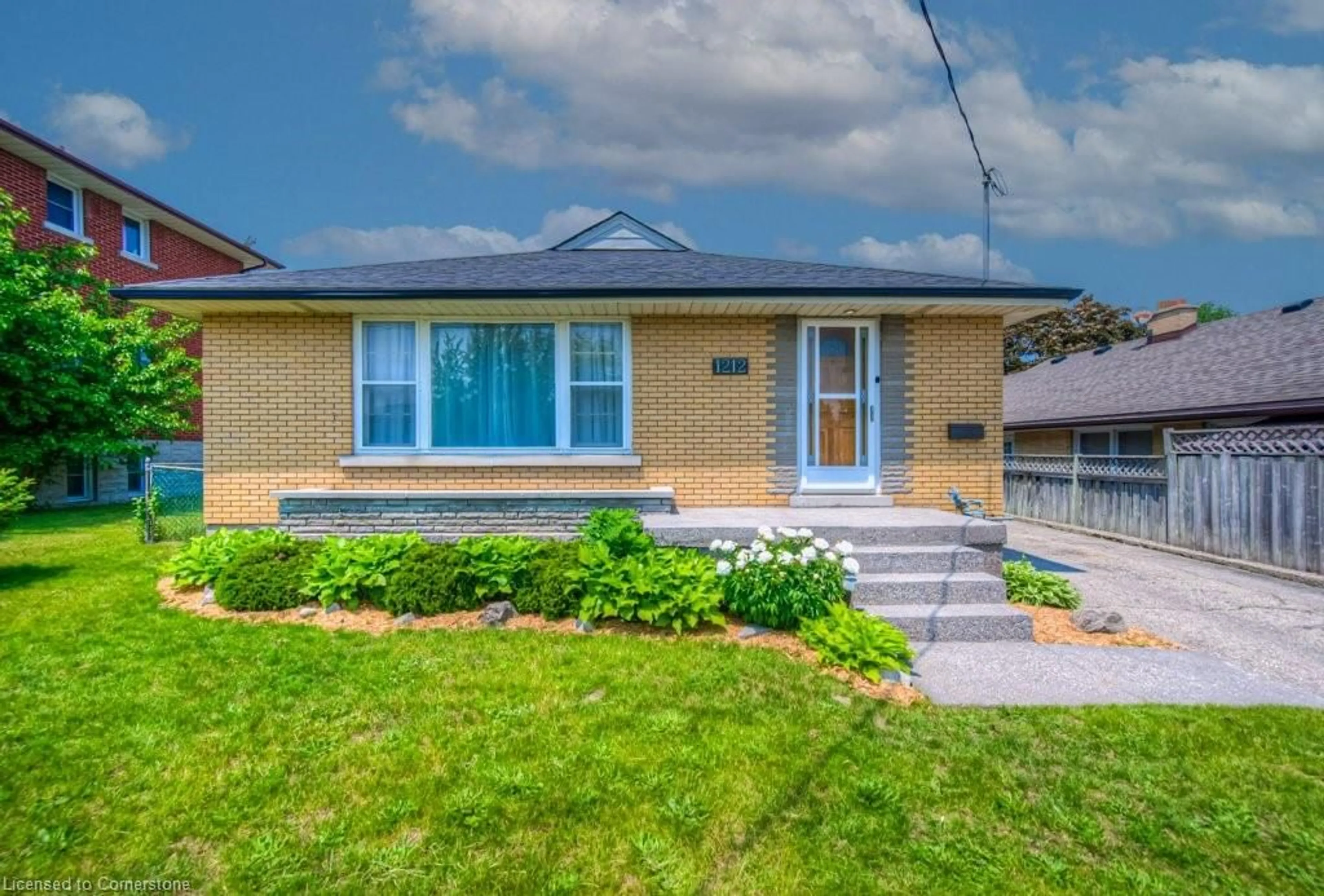 Home with brick exterior material, street for 1212 Queen's Blvd, Kitchener Ontario N2M 1C3