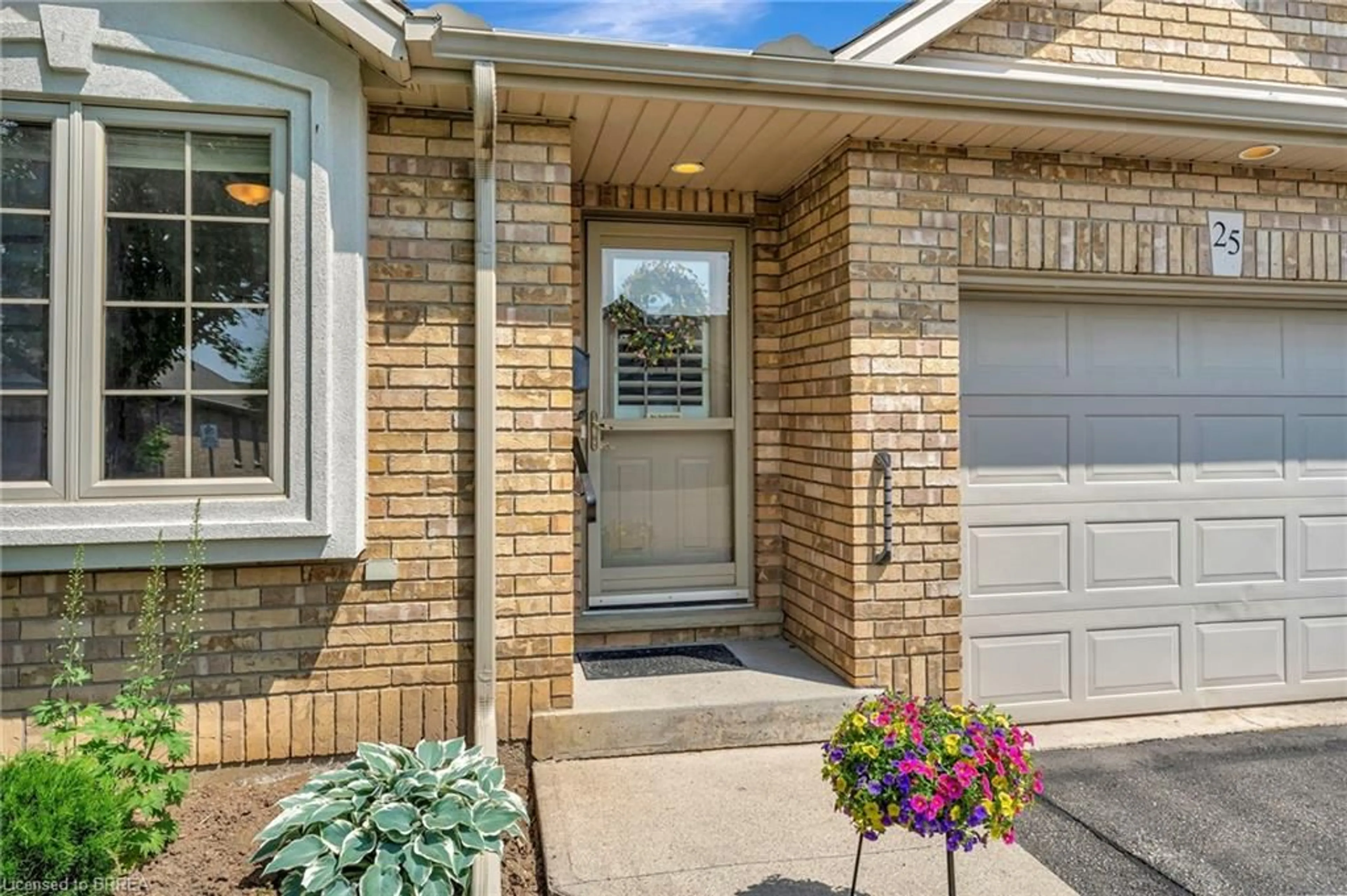 Home with brick exterior material, street for 25 Cobden Crt #25, Brantford Ontario N3R 8B5