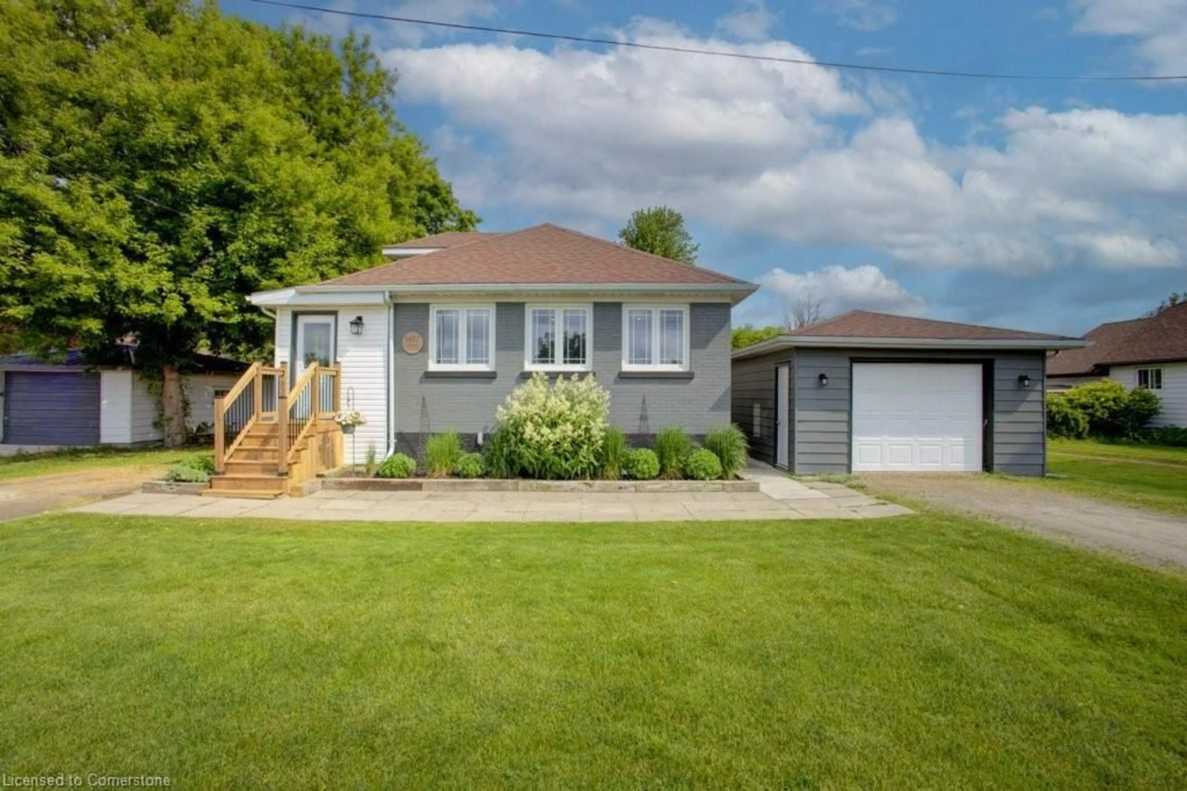 Home with vinyl exterior material, street for 1077 Harriston Rd, Howick Ontario N0G 2X0