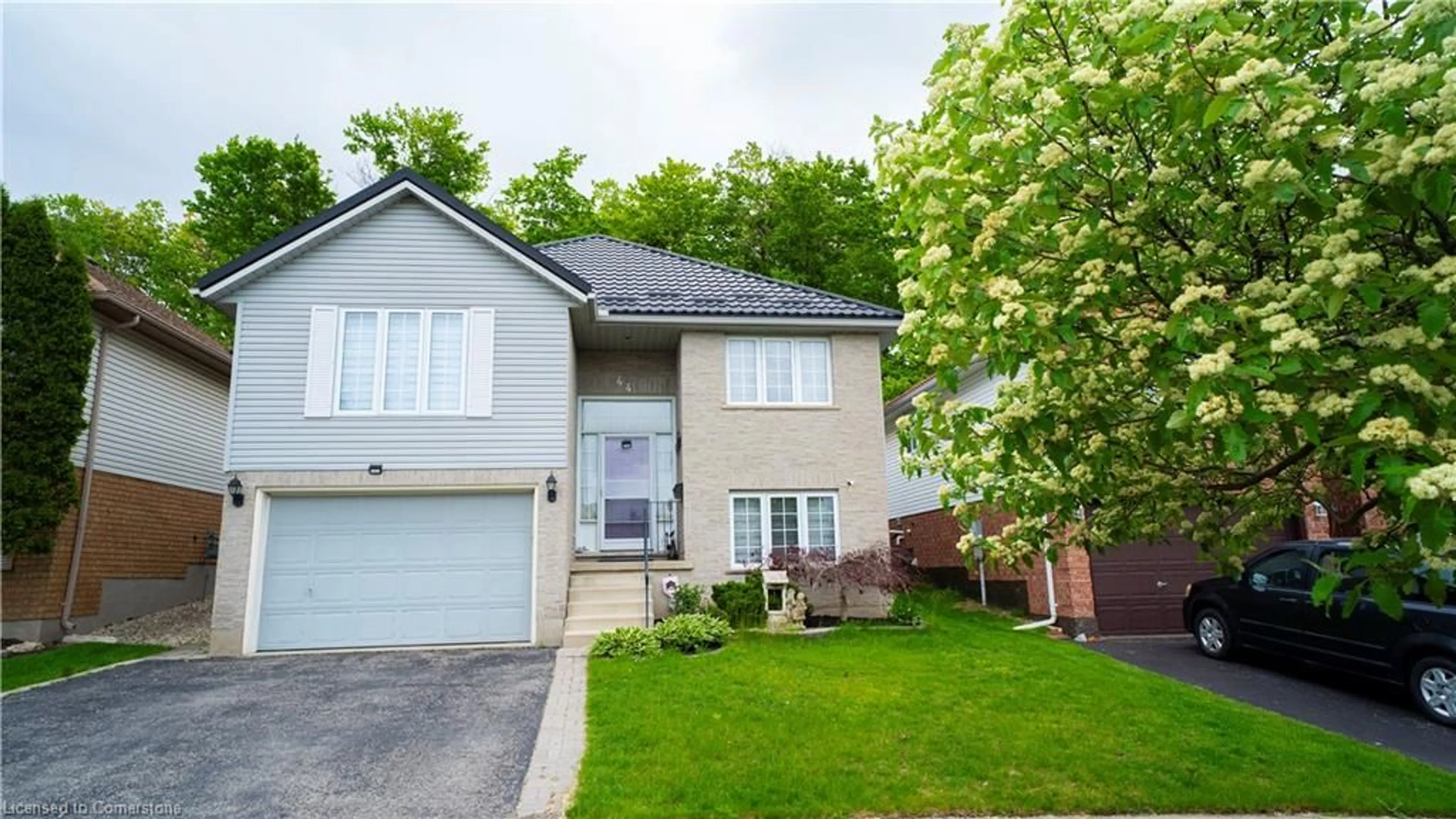 Home with vinyl exterior material, street for 44 Dunnigan Dr, Kitchener Ontario N2B 3W5