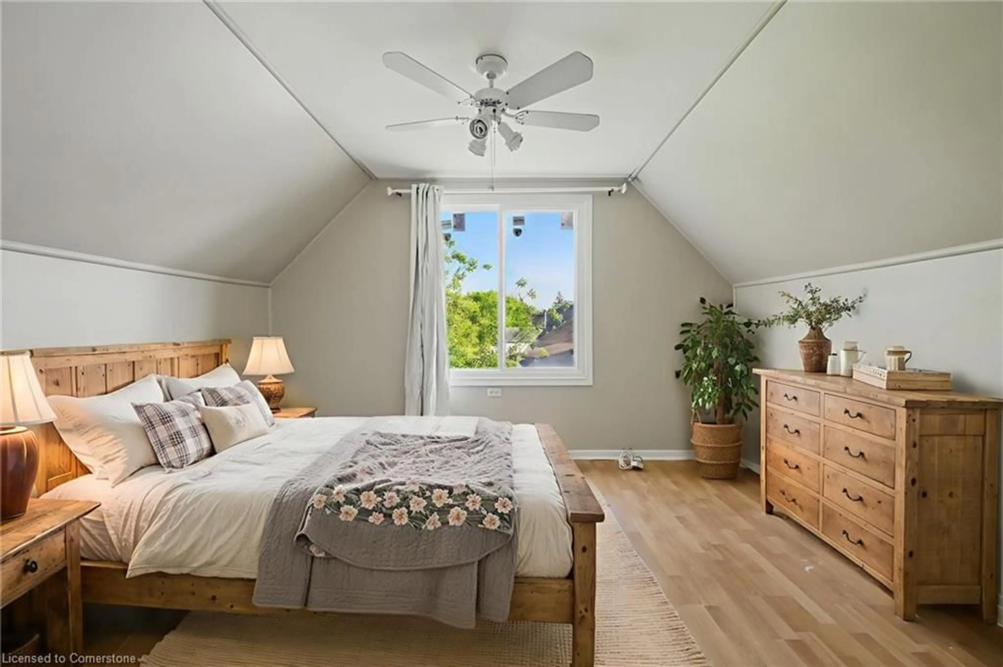 Bedroom with bed, wood/laminate floor for 23 Philip St, St. Catharines Ontario L2P 2M7