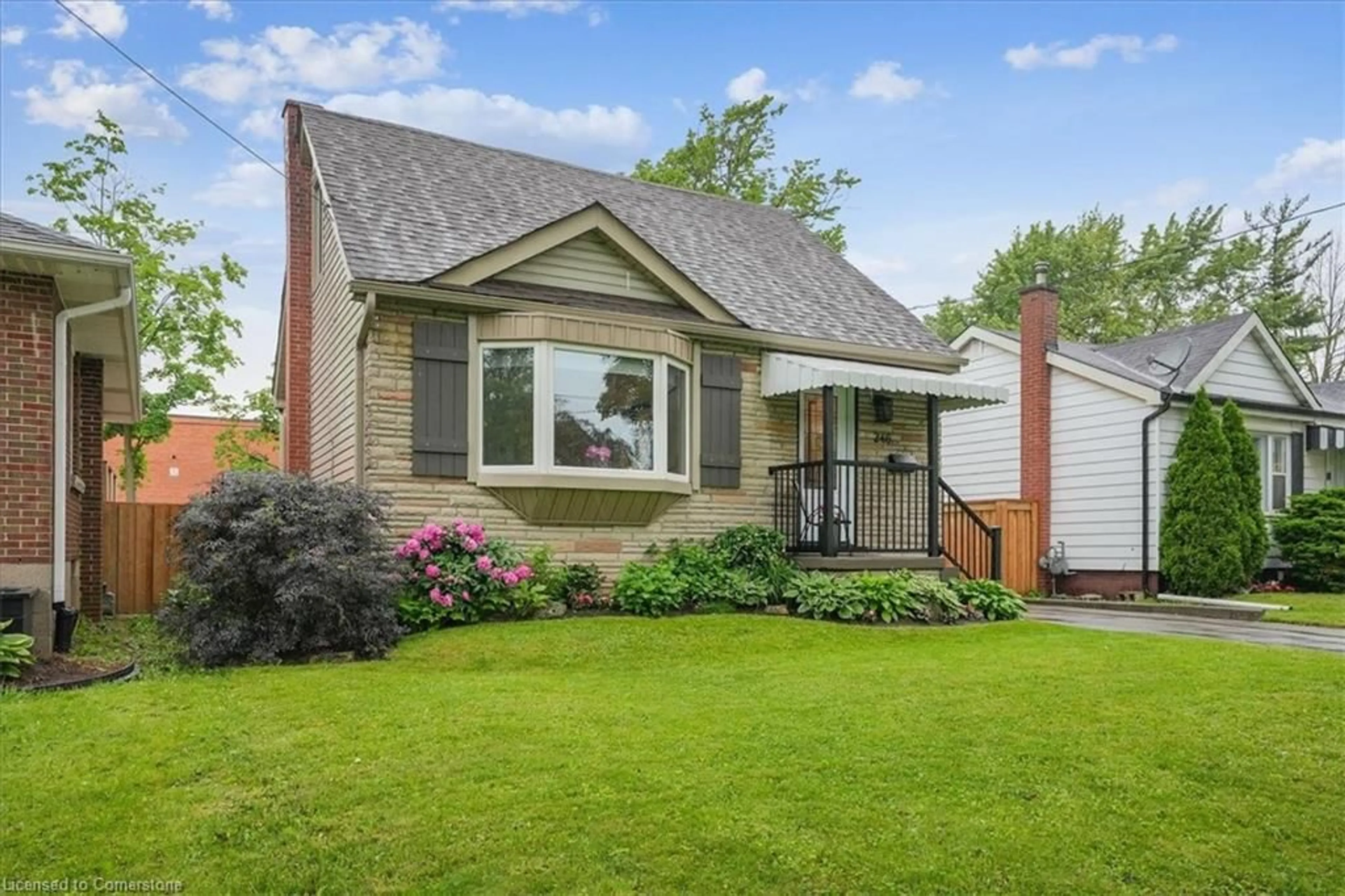 Home with vinyl exterior material, street for 246 East 43rd St, Hamilton Ontario L8T 3C5