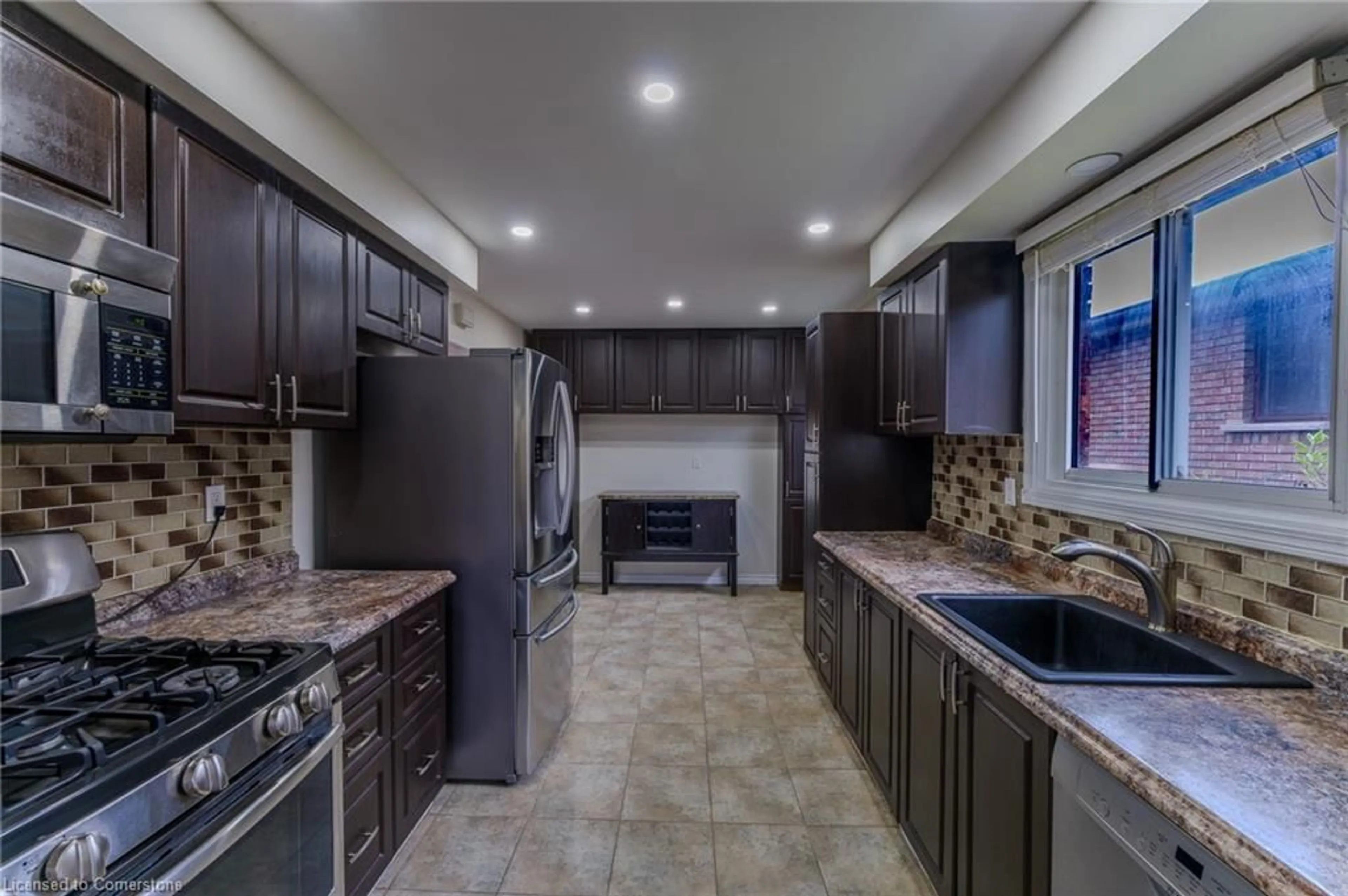 Open concept kitchen, ceramic/tile floor for 17 Taymall St, Hamilton Ontario L8W 1Z7