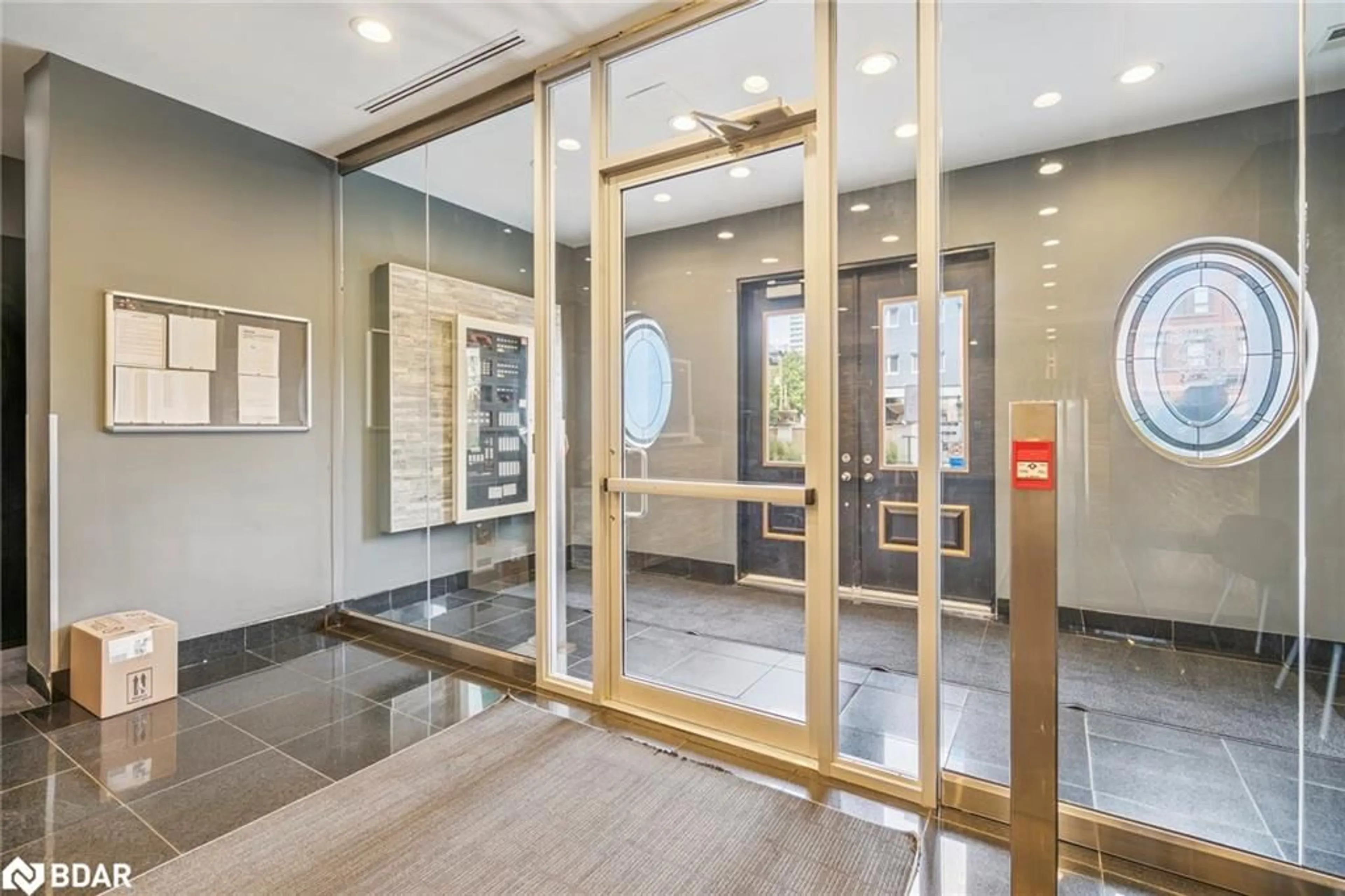 Indoor foyer for 135 James St #414, Hamilton Ontario L8P 2Z6